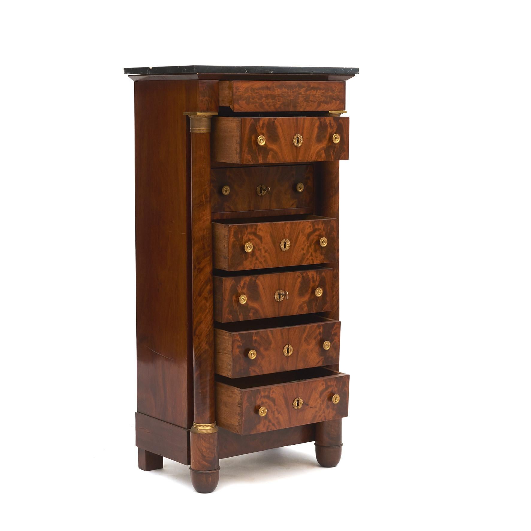 French Charles X chest of drawers in mahogany with bronze mounting
and a black marble top.

Original untouched condition. Dating from Approx.  1820.