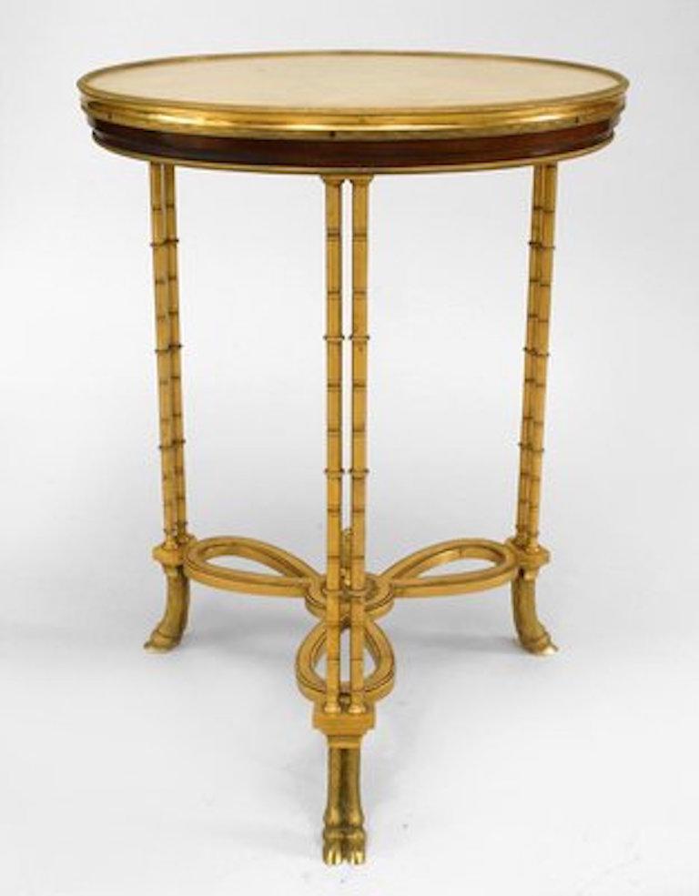 French Charles X style (20th century) bronze doré gueridon end table with faux bamboo legs with hoof design and marble top.
 
