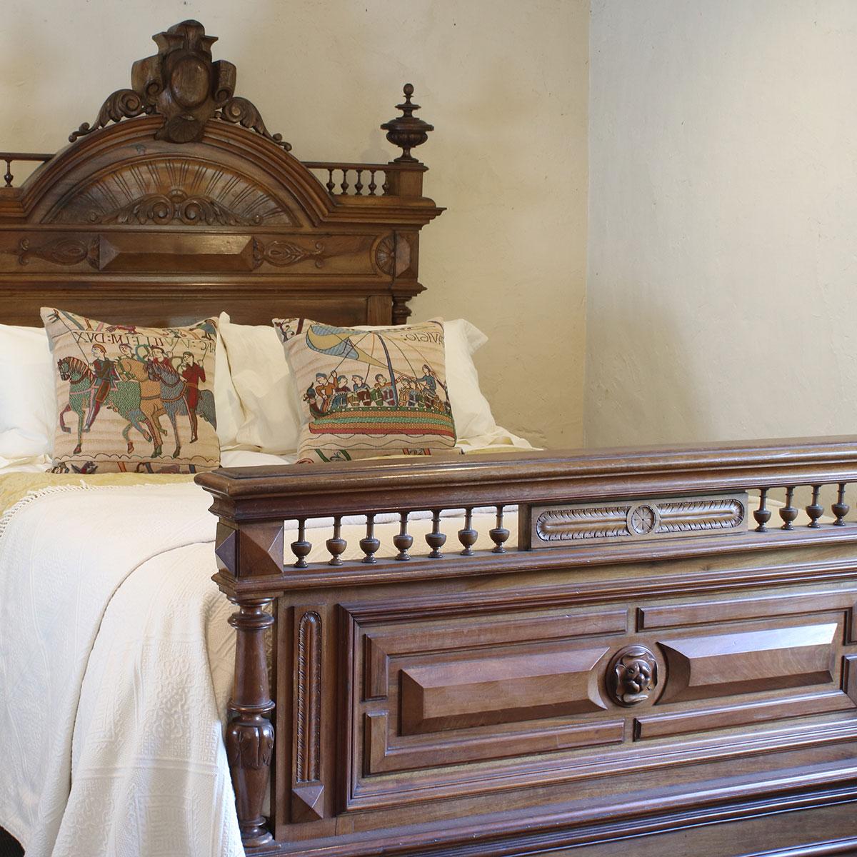 A magnificent walnut bed with turned posts, impressive head panel, pediment and turned finials.

This bed accepts a British King size or American Queen size, 5ft wide (60 inches or 150cm) base and mattress set.

The price includes a standard