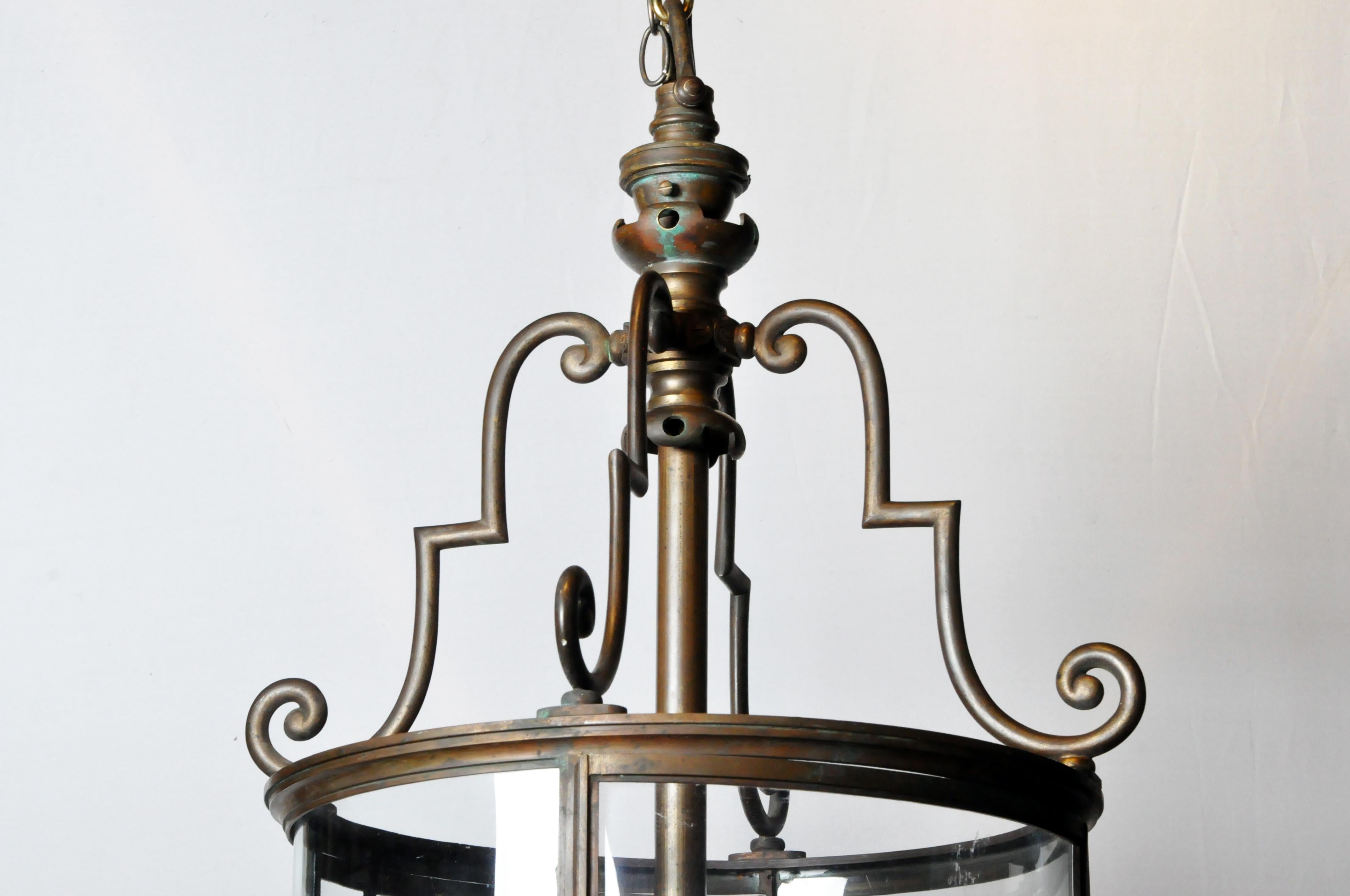 A handsome chateau lantern from France made from bronze and glass, circa 1900. Originally lit by gas, this lantern has since been rewired for 120-volt operation. The  bronze finish has been gently polished, laving the original patina intact.    The