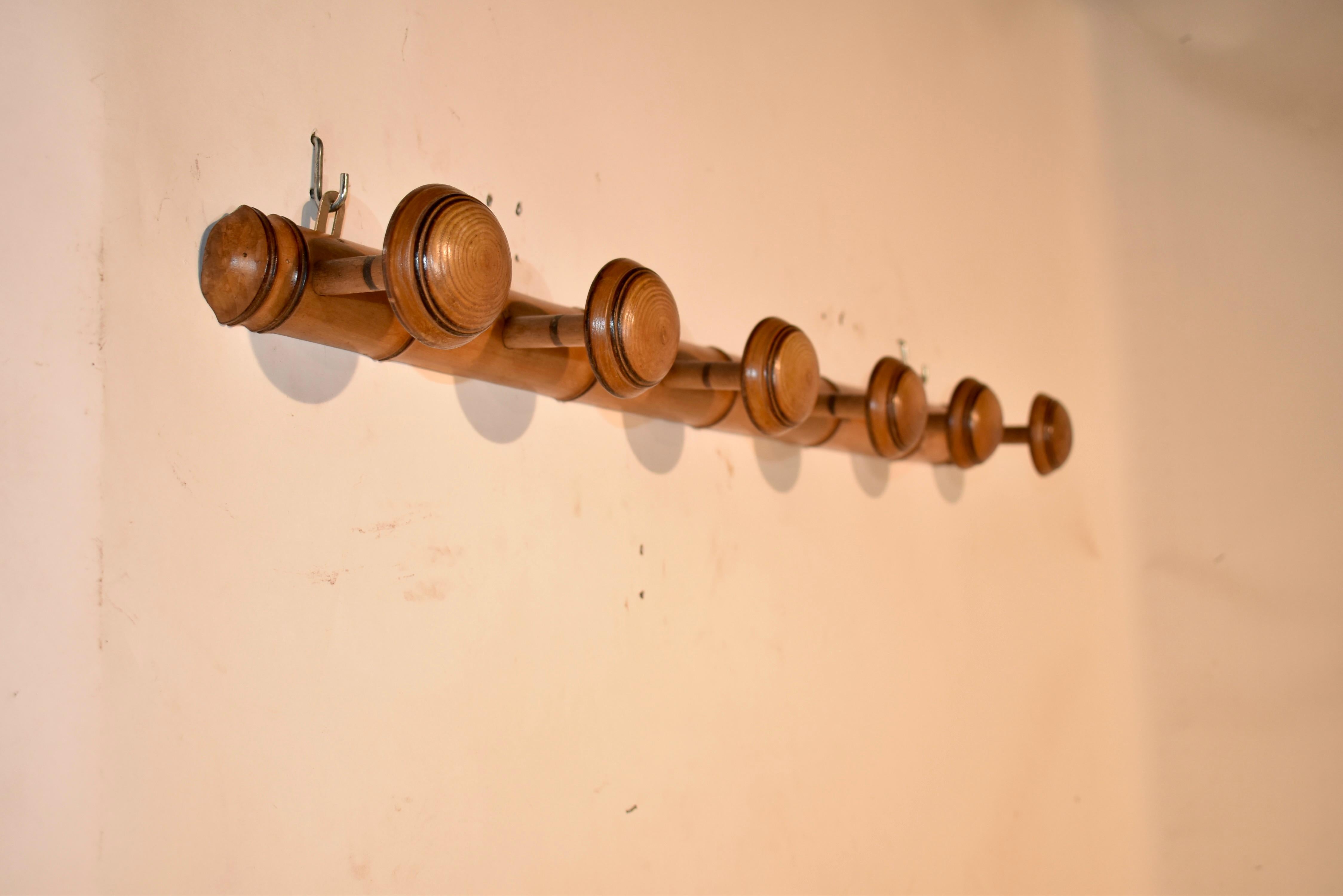 Turned French Cherry Six Peg Hat Rack, C. 1920 For Sale