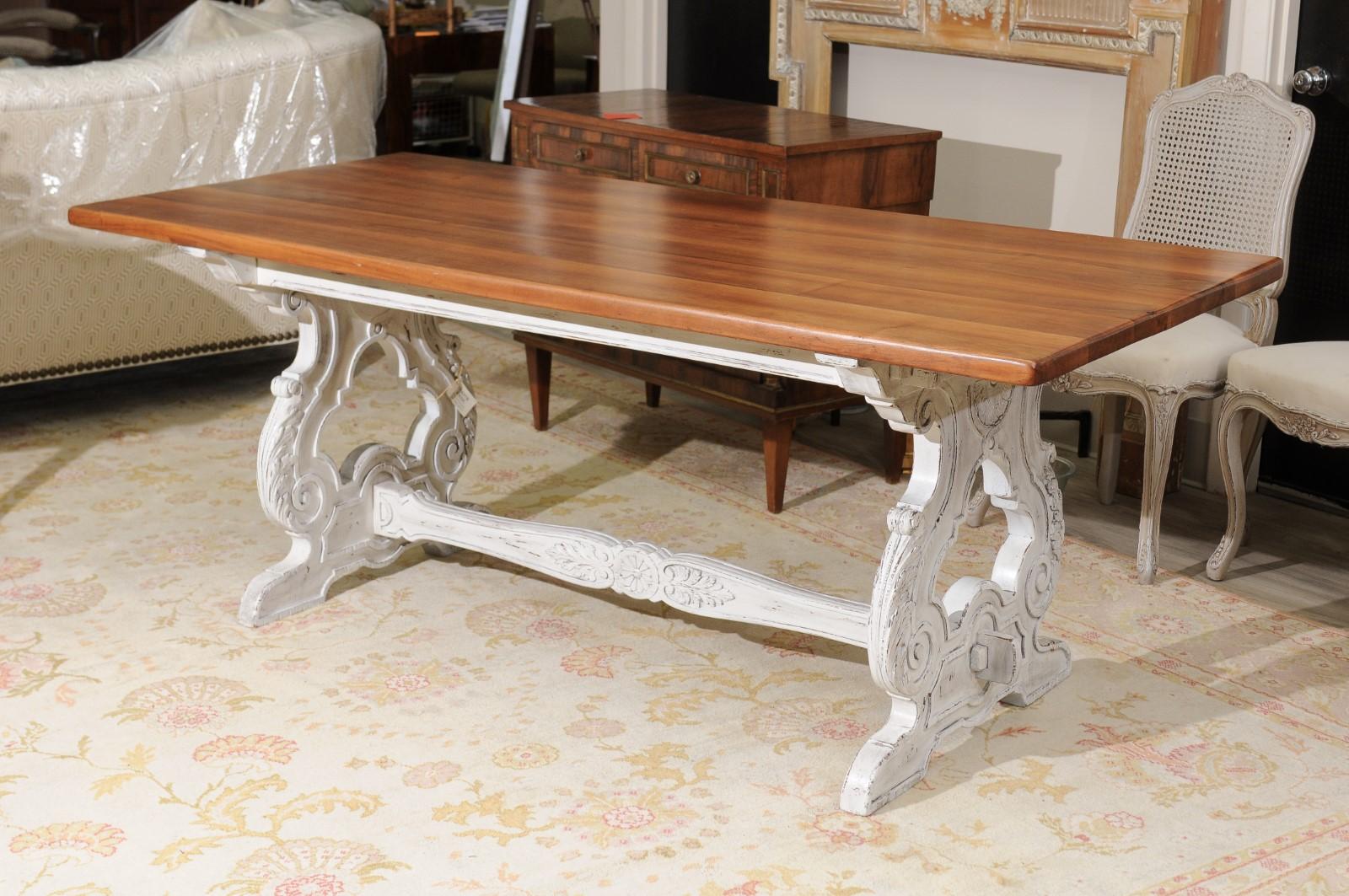 A rectangular sturdy solid cherry top sits on top of a beautifully carved painted base with an ornate stretcher. It would be perfect if used as a sofa table, dining table or library table.