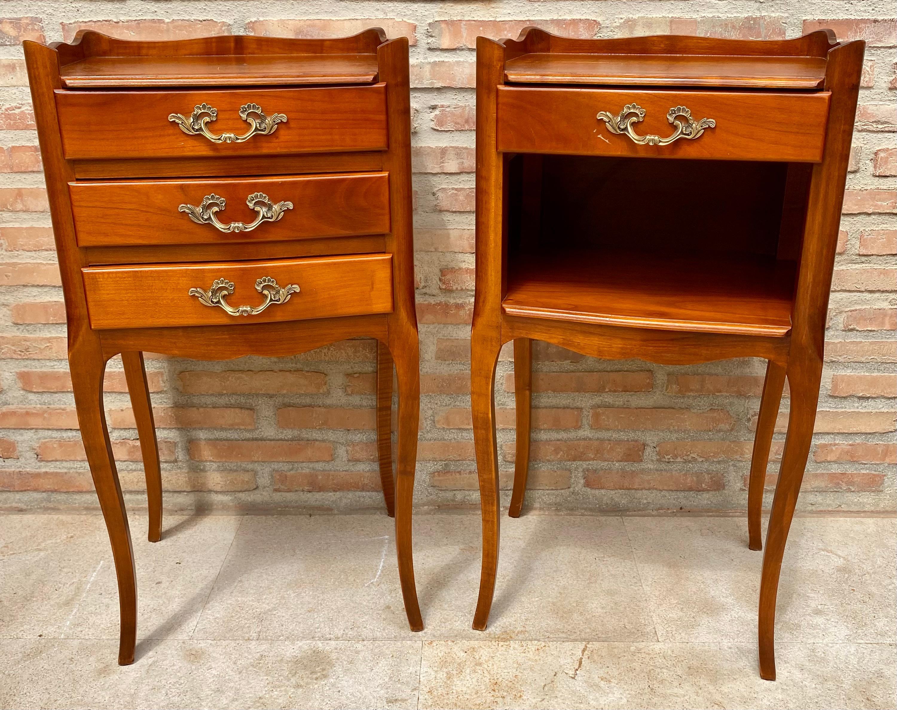 Elegant pair of coffee tables or bedside tables in antique 1960s Louis XV style, fine walnut. This pair of nightstands has particularly slim legs. One of them has three comfortable drawers and an open shelf on the front and the other has three