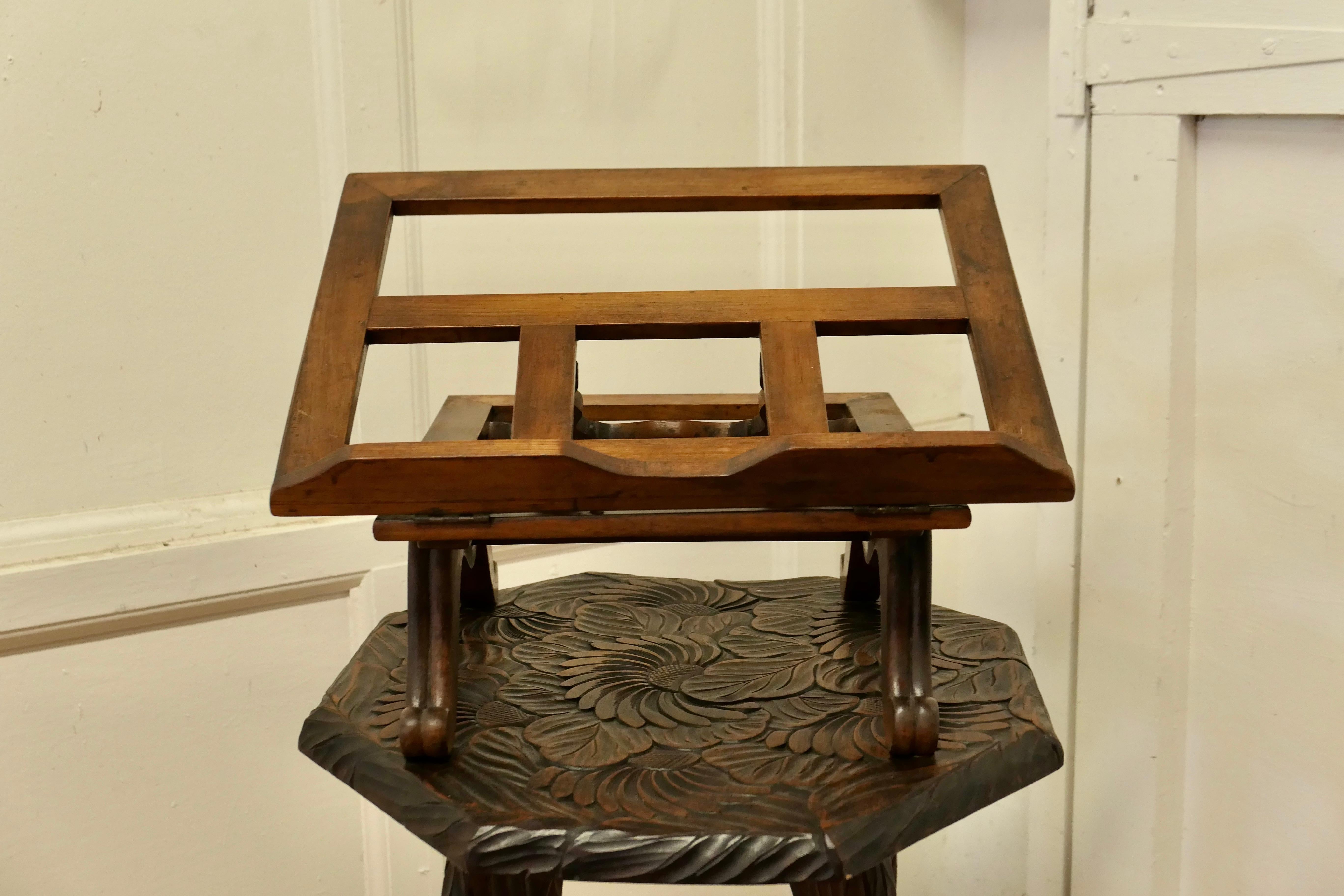 French cherrywood book rest or music stand, Lutrin.

This is a charming piece, it is made in solid cherrywood and dates from the end of the 19th Century .
The base of the stand is set on dainty turned legs, above this is set the adjustable book