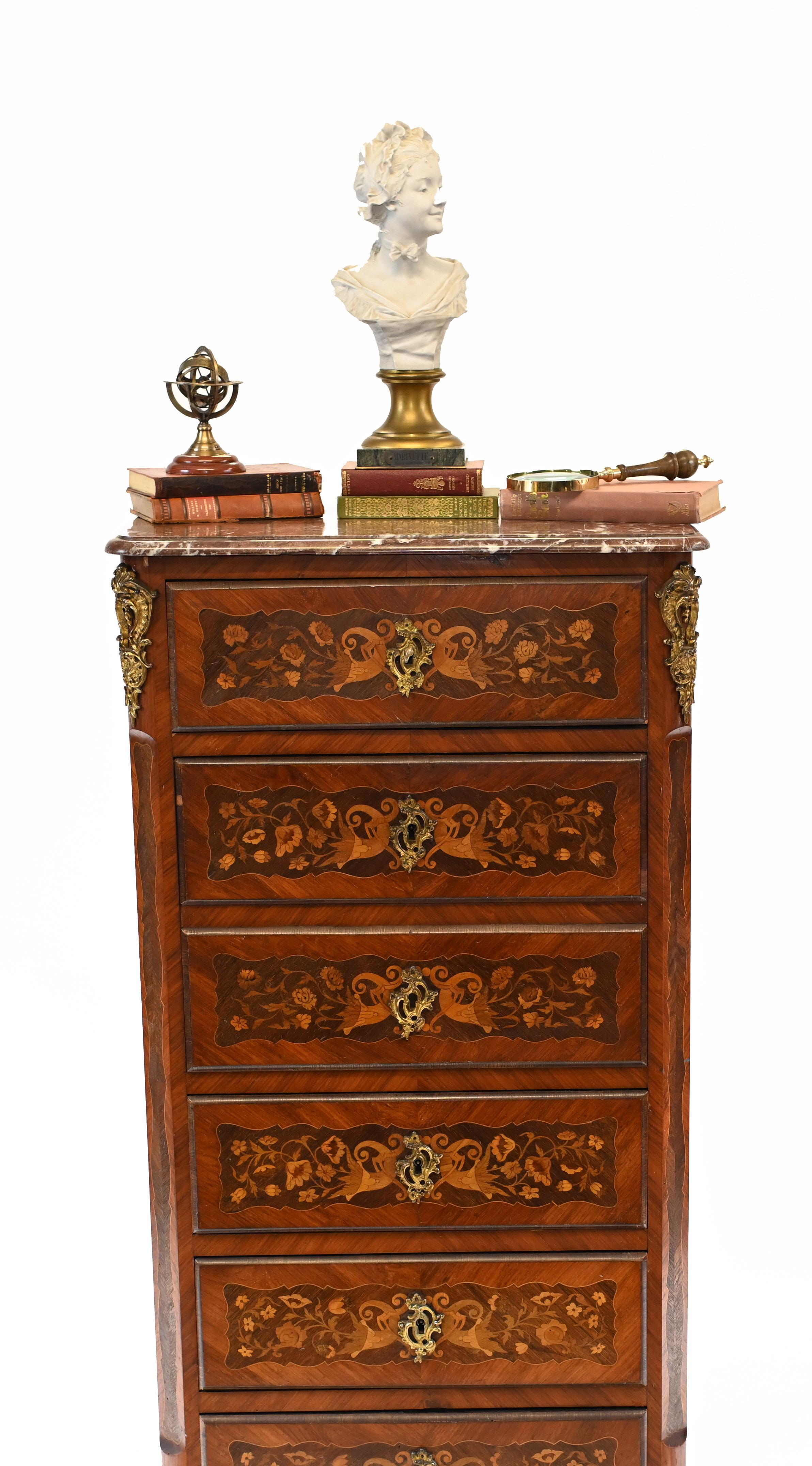 Gorgeous antique French chest - or tall boy - with six drawers
Features a marble top and a proffusion of intricate floral inlay
Circa 1880
Bought from a dealer at Les Puces antiques market in Paris 
Original ormolu fixtures on this handsome