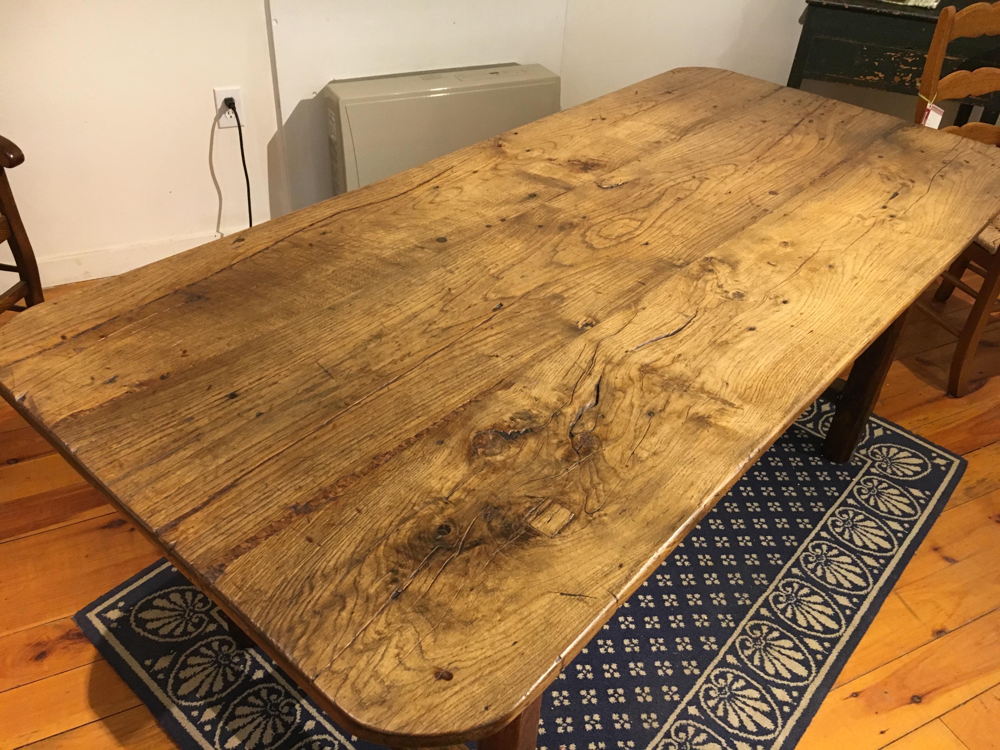 The top on this chestnut farm table is simply fabulous! Rounded corners and a terrific patina make this table a knockout. Did I mention that there is one drawer at the end of this table and a great T-stretcher base? It was a very fortunate purchase