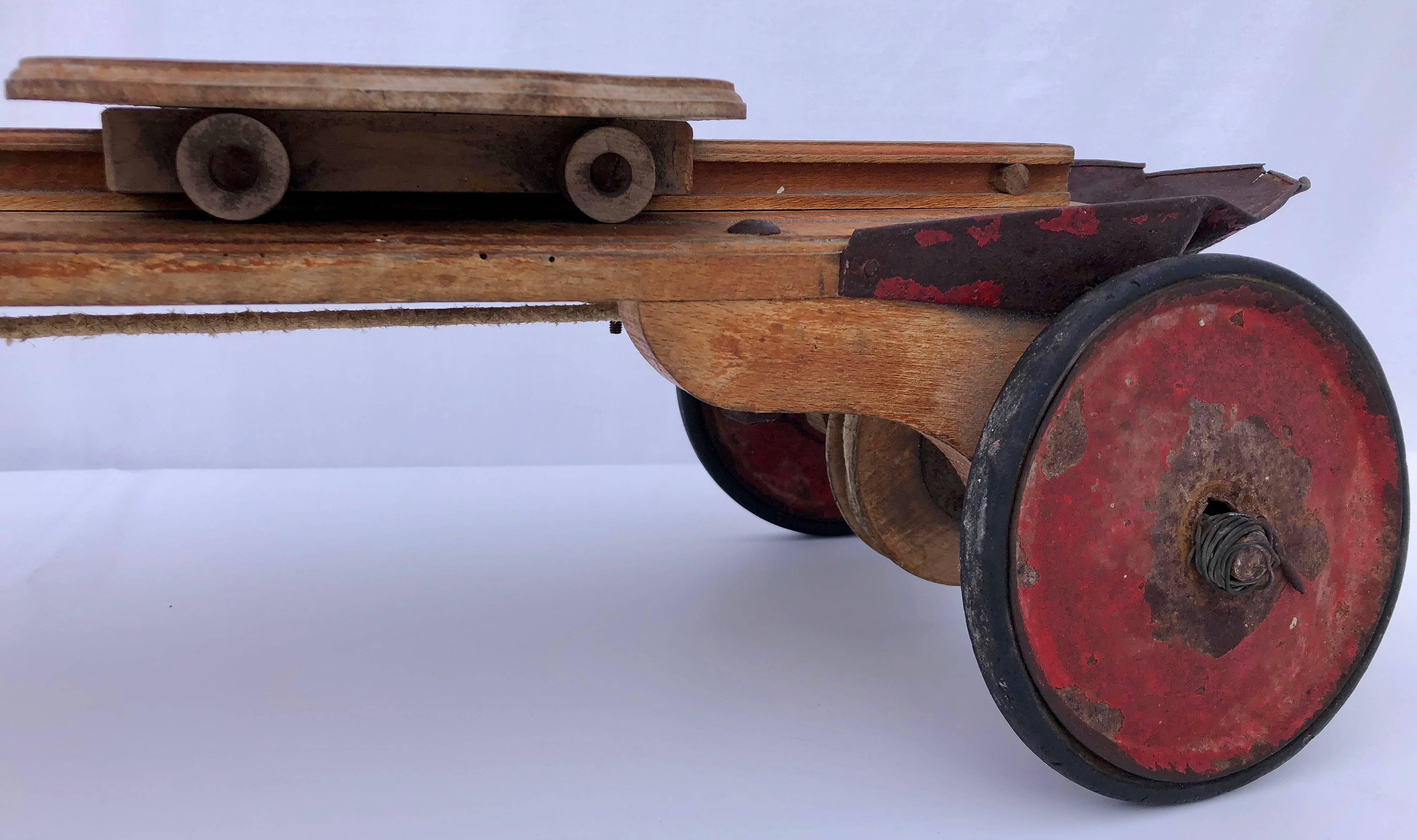 French Child's Antique Four Wheel Wood Vehicle with Sliding Seat, 1920s For Sale 1