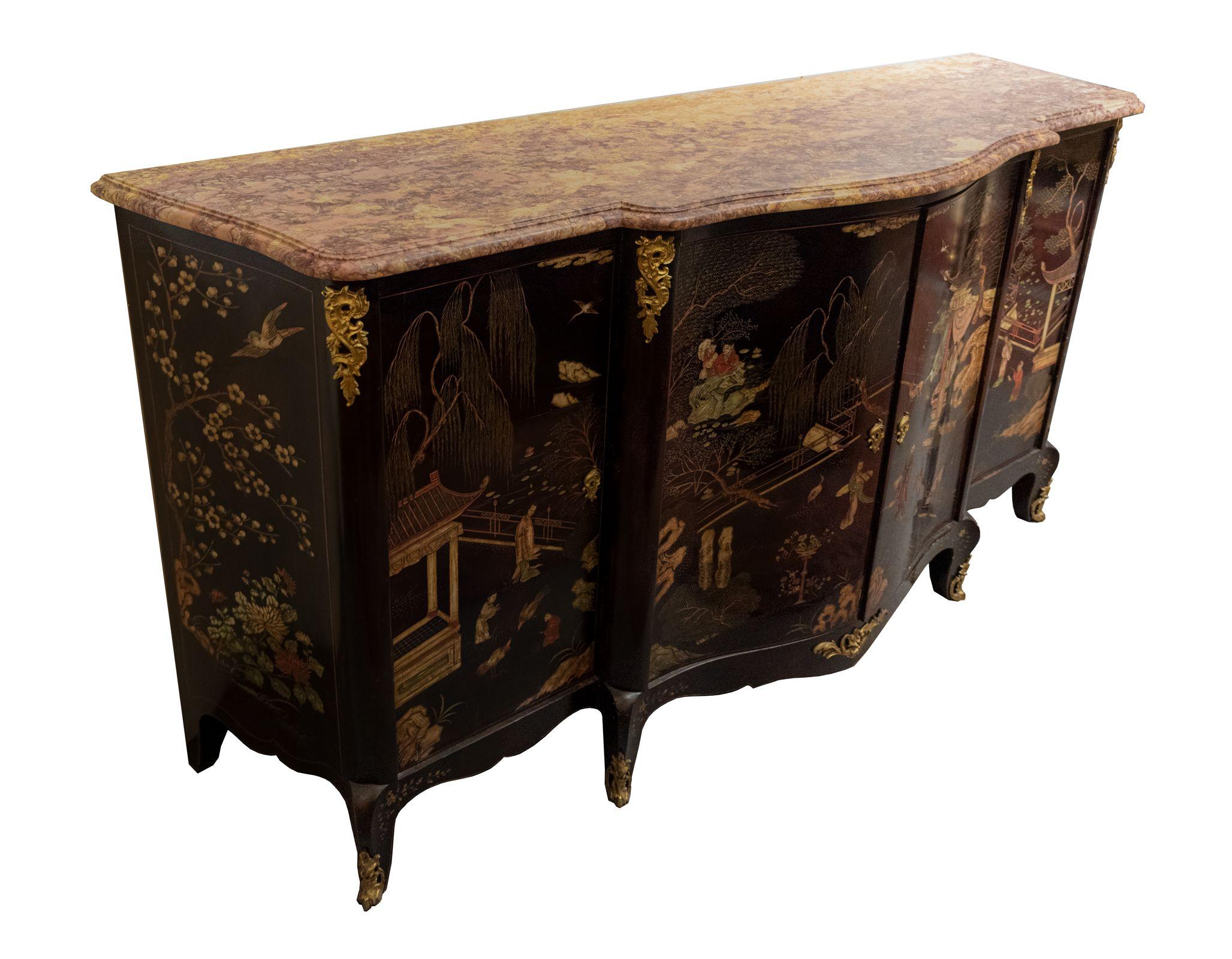 A French Transitional-style Coromandel buffet with Ormolu mounts and marble top. The four doors and two side panels are decorated in Coromandel lacquer depicting Chinese literary scenes, flora and fauna. The legs, columns and bottom stretcher