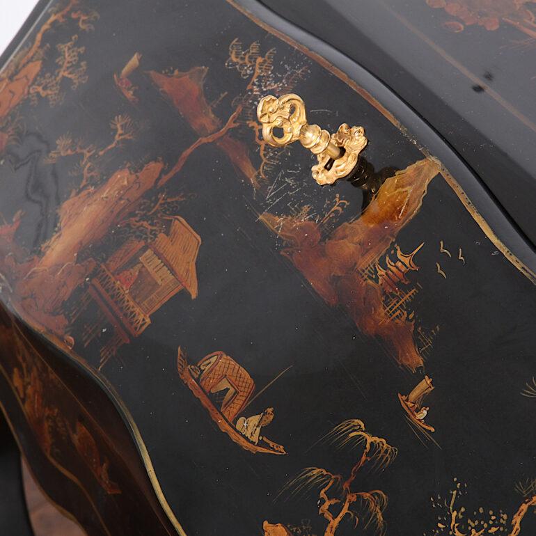 An elegant French Chinoiserie lacquer Louis XV style bombe writing desk, the leather drop-front writing surface opening to reveal a lacquered interior fitted with two drawers, the whole standing on slender cabriole legs with ormolu mounts. 

 