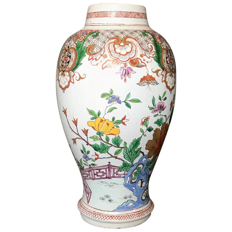 French Chinoiserie Majolica vase. Purple, blue, green and yellow baluster vase with gilding and diapering in the chinoiserie style with bugs and butterflies and plum blossoms. Red underglaze markings for Aprey, France, mid-19th century.
Dimensions: