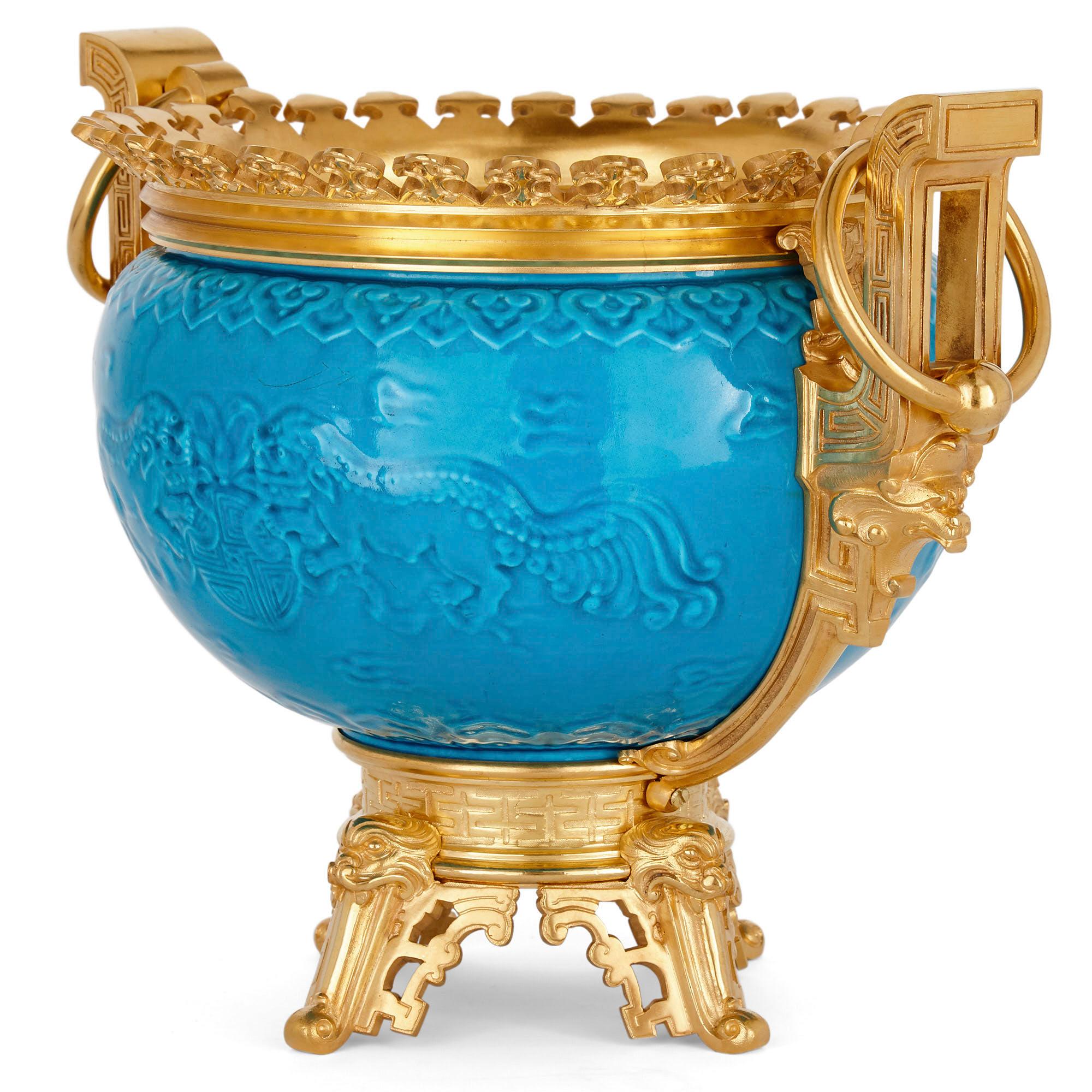 French chinoiserie style gilt bronze and faience jardinière
French, late 19th century
Measures: Height 28cm, width 37cm, depth 27cm

This stunning jardinière is wrought in the distinctive French chinoiserie manner, the ‘Persian blue’ faience