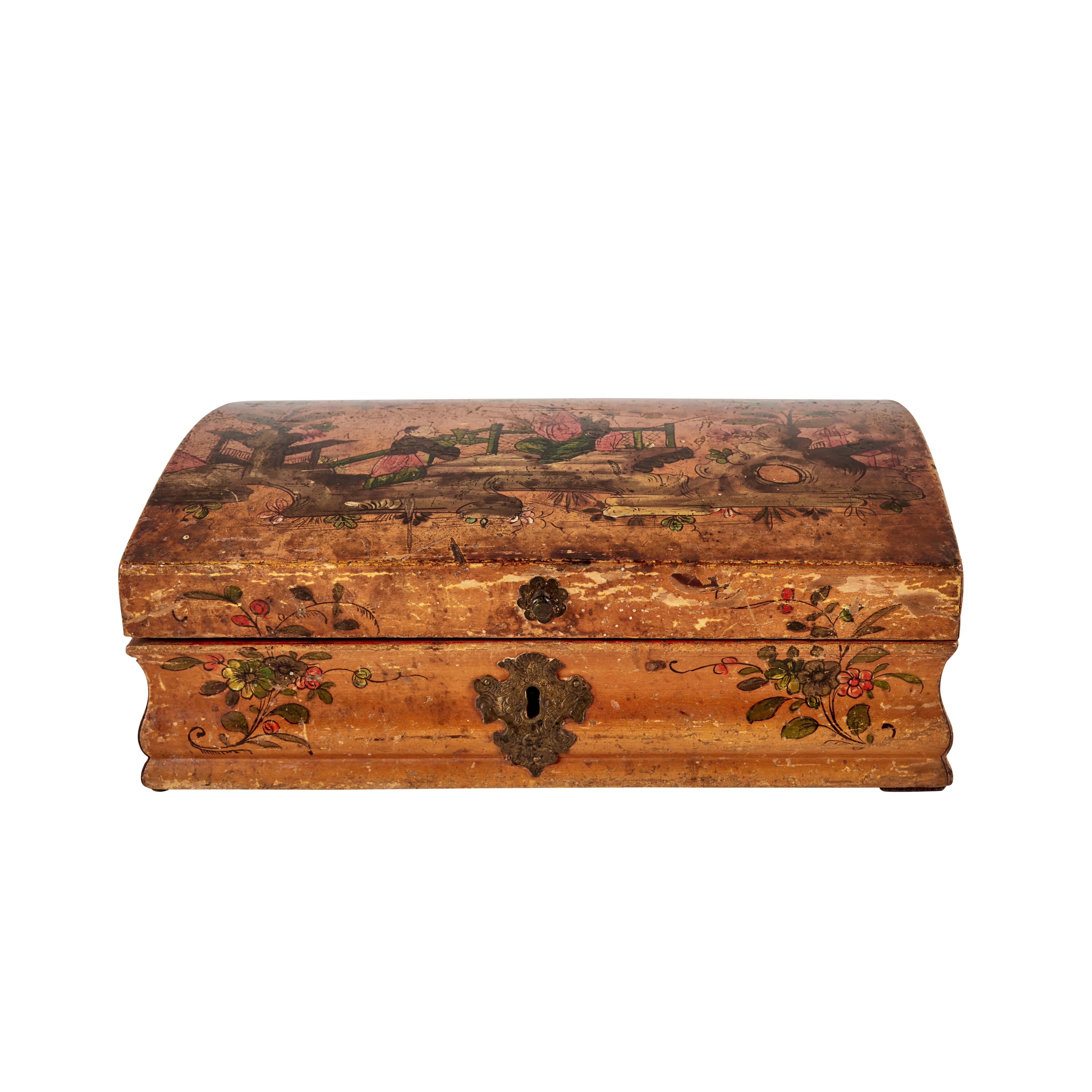 Hand-carved and painted, arched-top, Chinoiserie decorated hinged wig box with original bronze hardware. The top featuring a trio of figures in a lush landscape of blossoming trees.