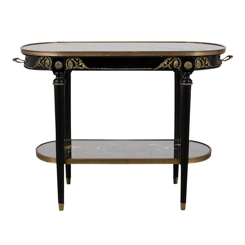 This 1880s antique French two-tier chinoiserie style side table features an ebonized finish and brass accents around the top. The top and bottom tier both feature unique hand painted oriental scenes depicting people celebrating and riding on a