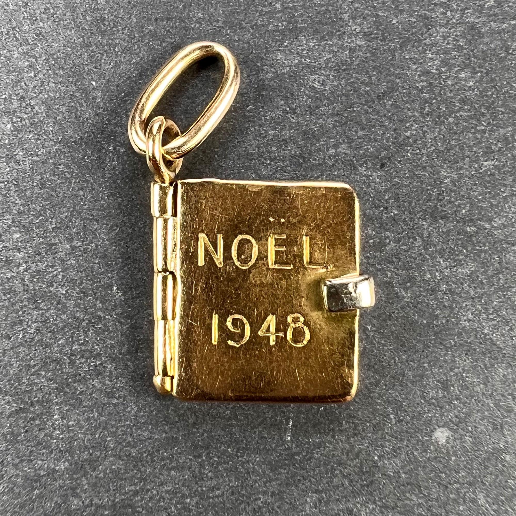 A French 18 karat (18K) yellow gold charm pendant designed as a book with three pages with a white gold clasp. Engraved to the front cover ‘Noel 1948’ for Christmas 1948, and inscribed to the second page ‘Bernard a Odette’. Unmarked but tested as 18