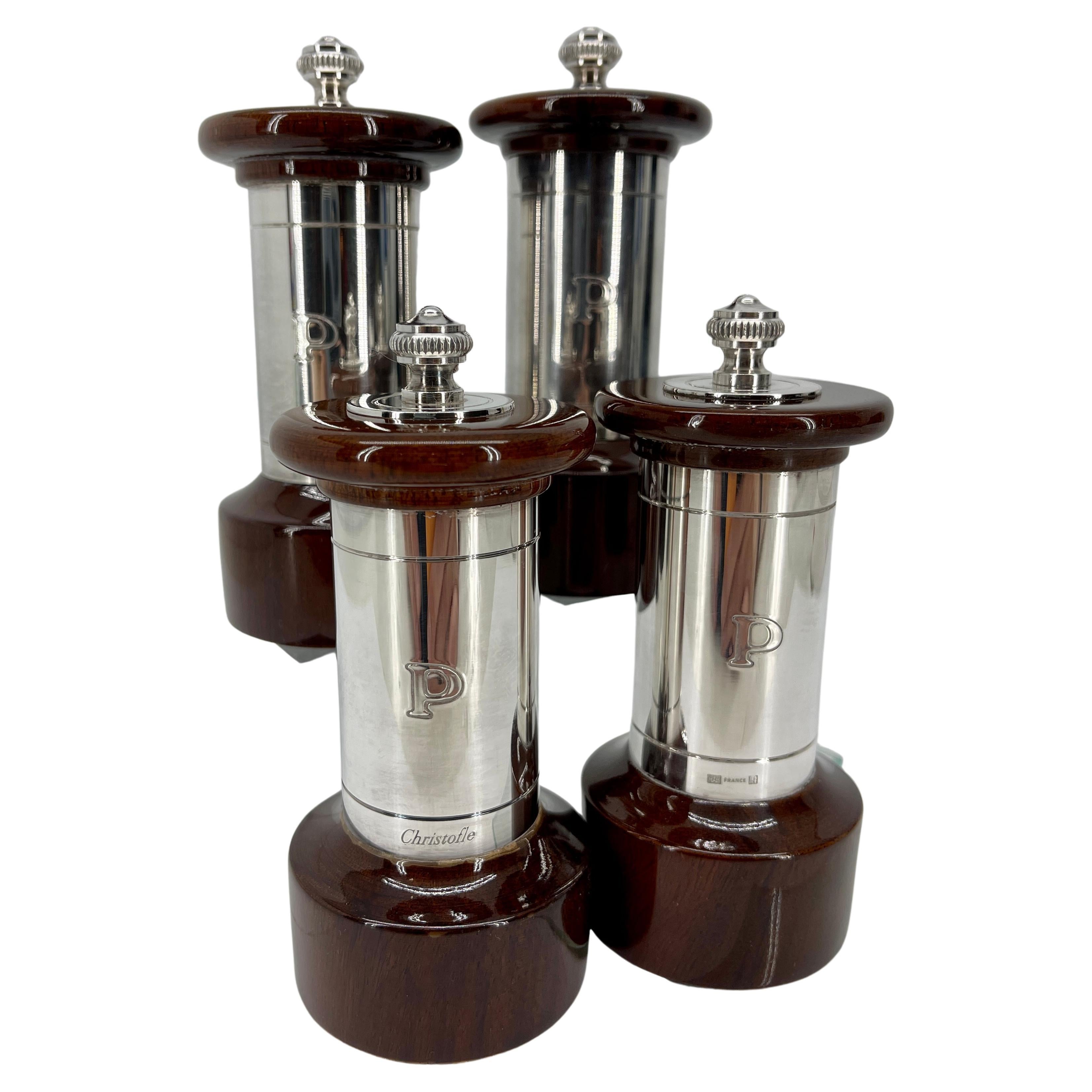 Vintage 20th century Christofle silver plated and wooden pepper grinder set. This modern and elegant set of pepper mills are a wonder example of the house of Christofle design. Classic French style, combining beauty and function, the pepper mills