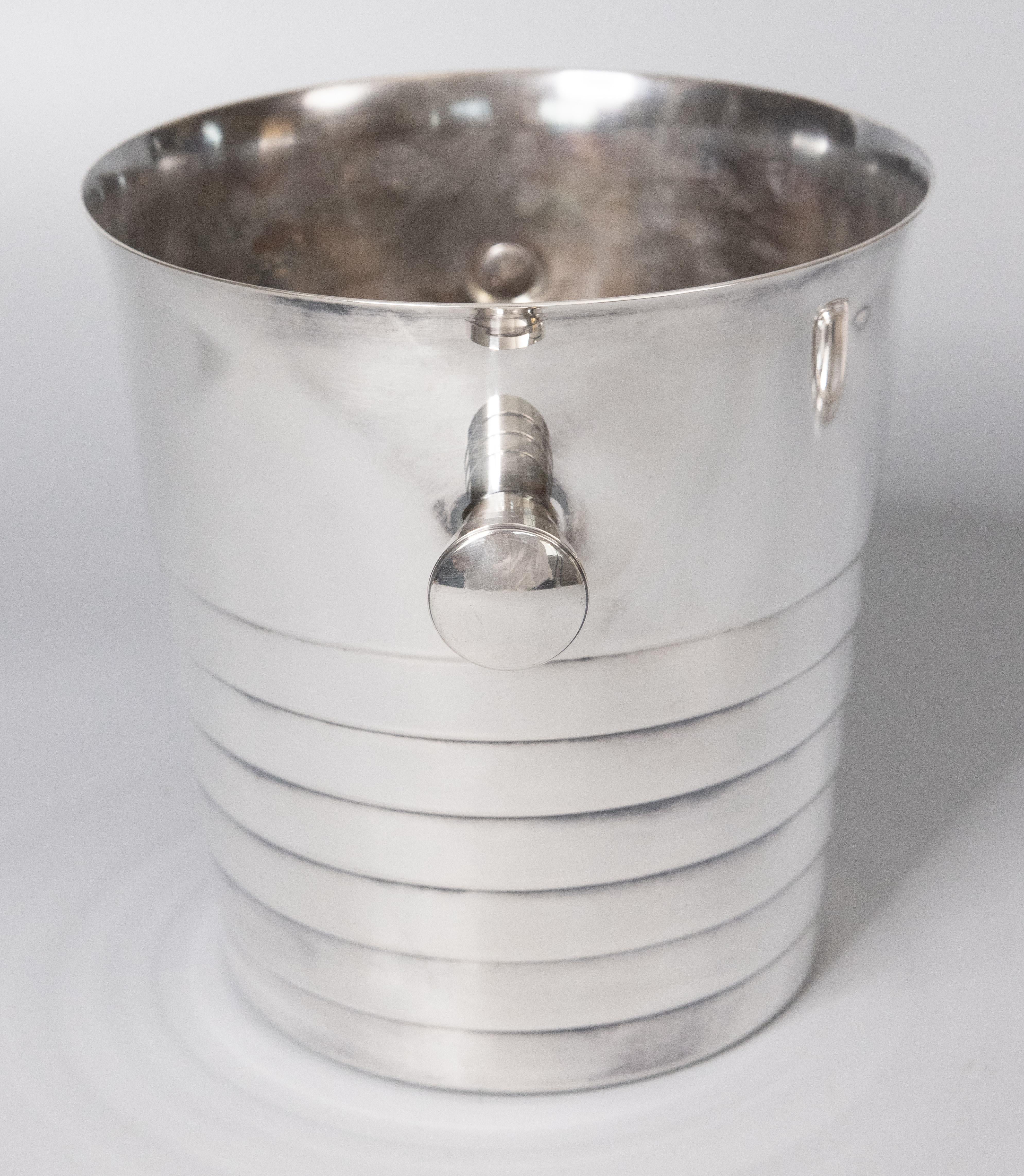 A superb vintage Art Deco style Christofle silverplate champagne ice bucket / wine cooler made in France. Hallmarked on reverse. This stylish ice bucket is solid and heavy with a sleek design, perfect for the modern home. Add the finest French
