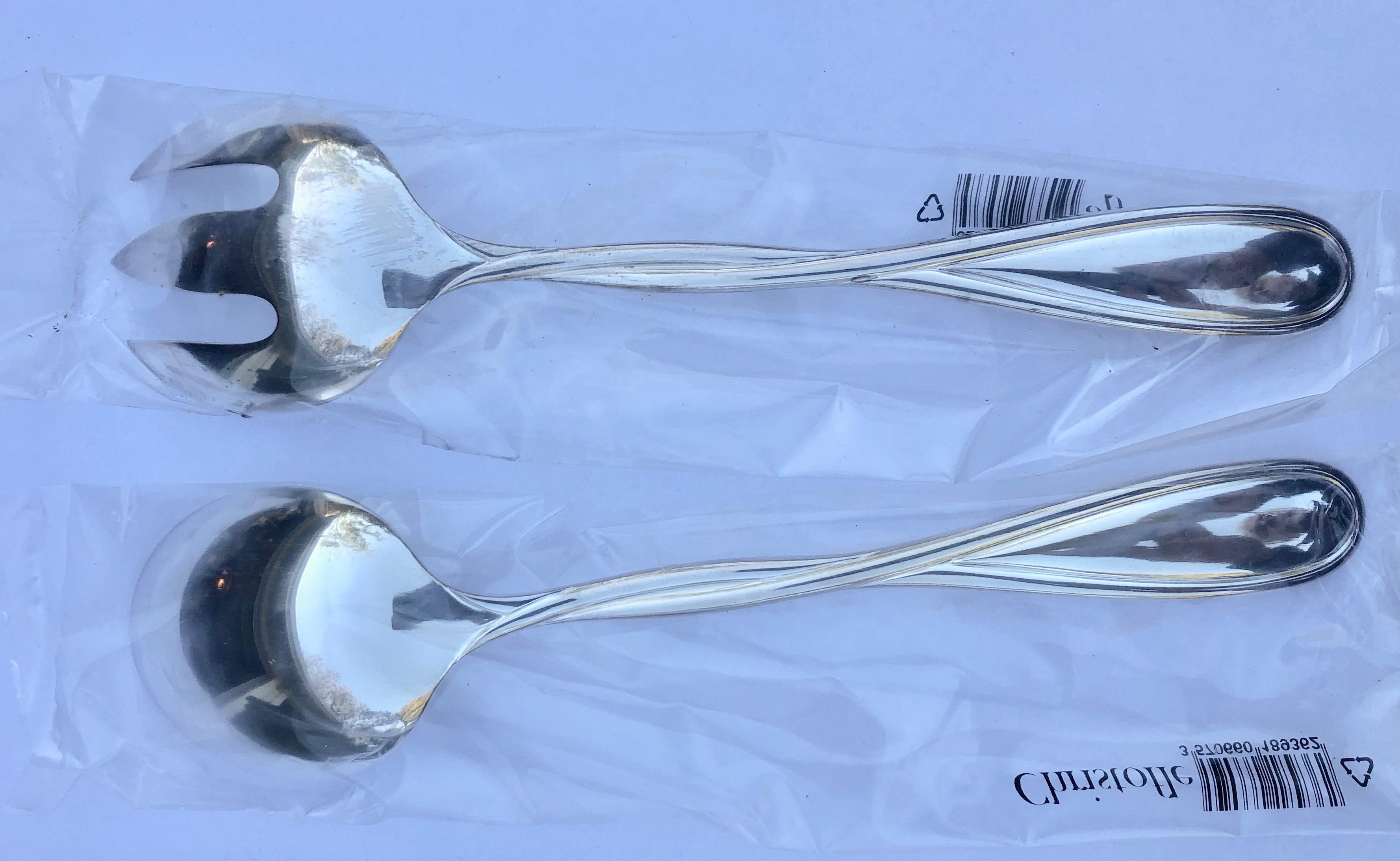 This is a beautiful French silver plated Christofle Galea set of a serving fork and spoon. There are multiple sets available for all your serving needs. All the pieces are new, never used and under their original plastic pouches and Christofle
