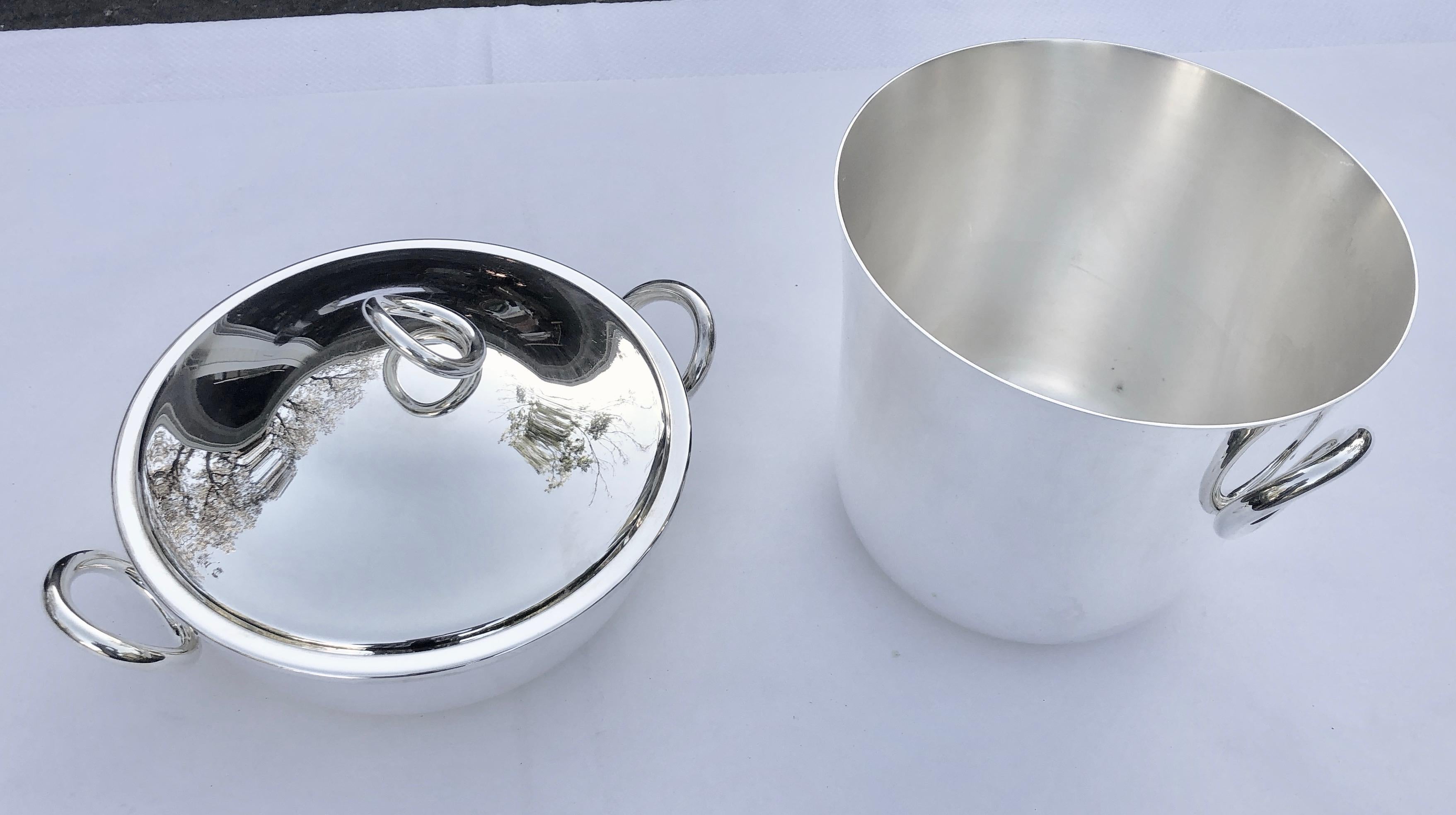 Set a playfully elegant table with the silver plated and lidded serving dish in the Vertigo pattern. Perfect for serving vegetables and other sides. Vertigo’s bold motif, a subtly asymmetrical, thick ring often placed playfully askew, can be found