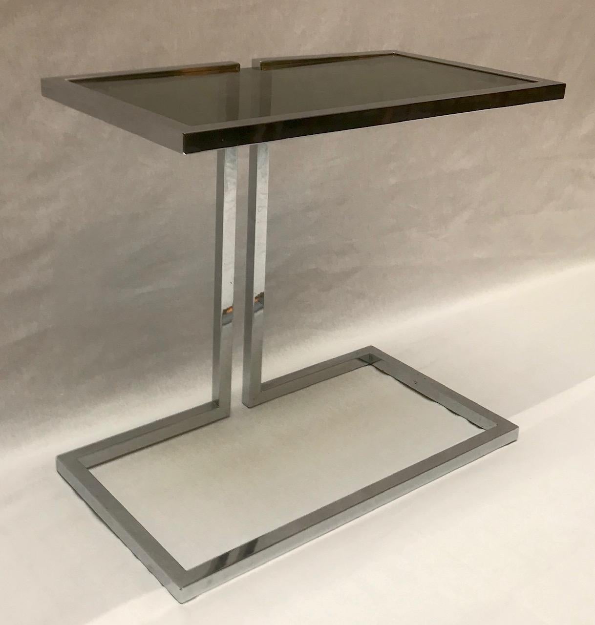 Small French chrome console with smoked glass top.