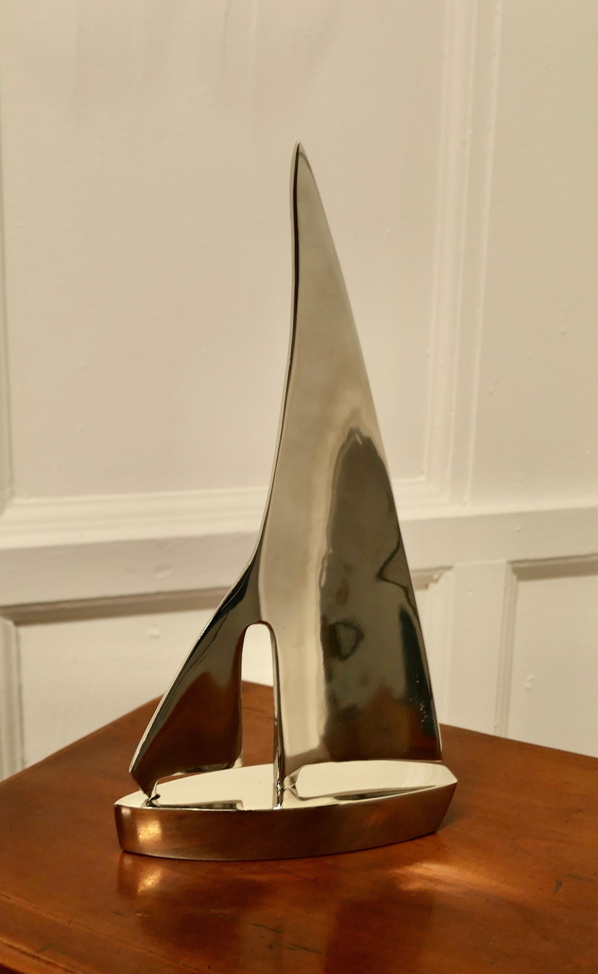 French chrome desktop model of a yacht.

A super piece and a great desk ornament for the sailor that has everything else. 
This model is polished to a highly reflective stream line chrome finish.
It is in very good condition, it is 7.5” long,