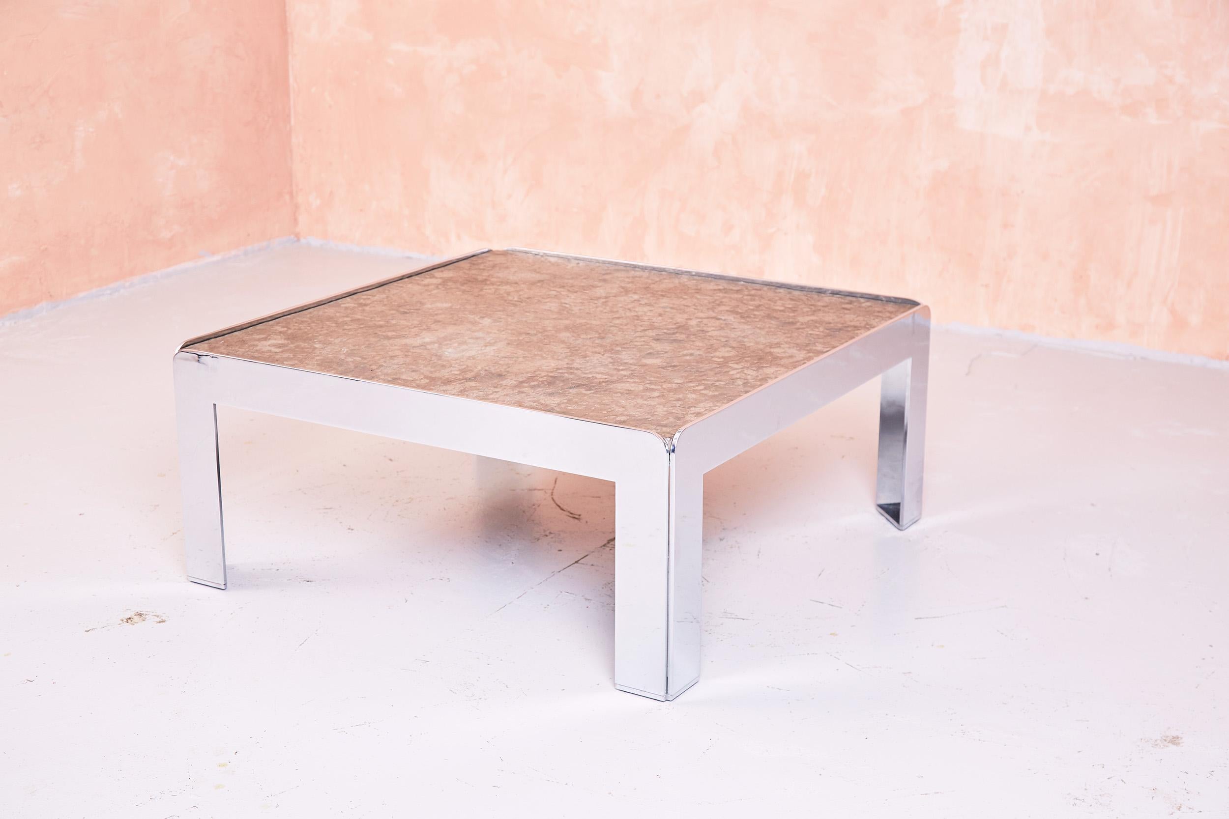 1960s French coffee table with solid chromed steel frame and inset slate top.

The slate is approximately an inch thick and very substantial.

There is a label to the verso of the slate top, suggesting the table was moved over to the UK from