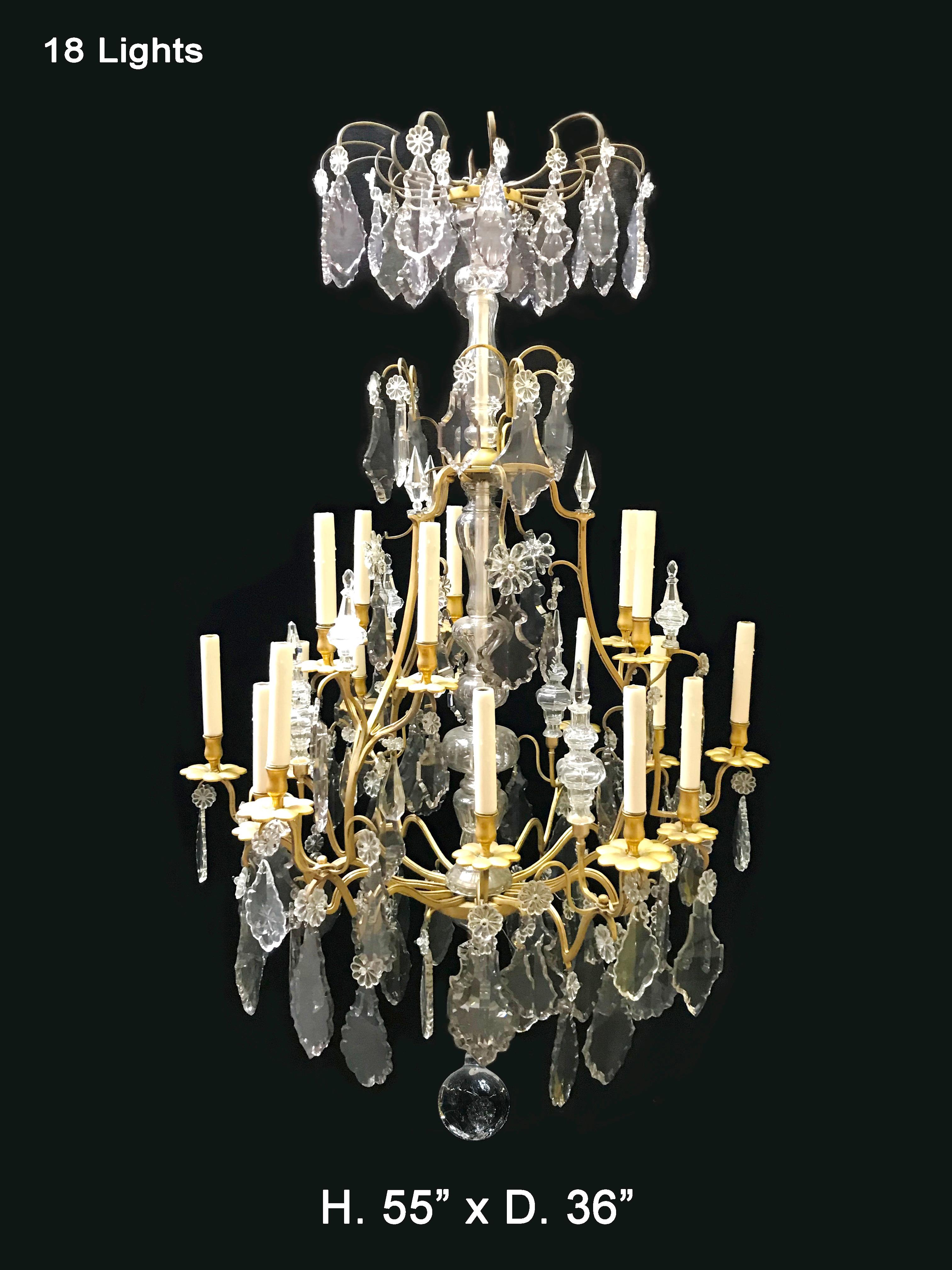 Fabulous 19 century French Louis XV style finely gilded bronze 18-light chandelier mounted with beautifully cut crystal prisms and spikes, possibly Baccarat.
Measures: H. 55