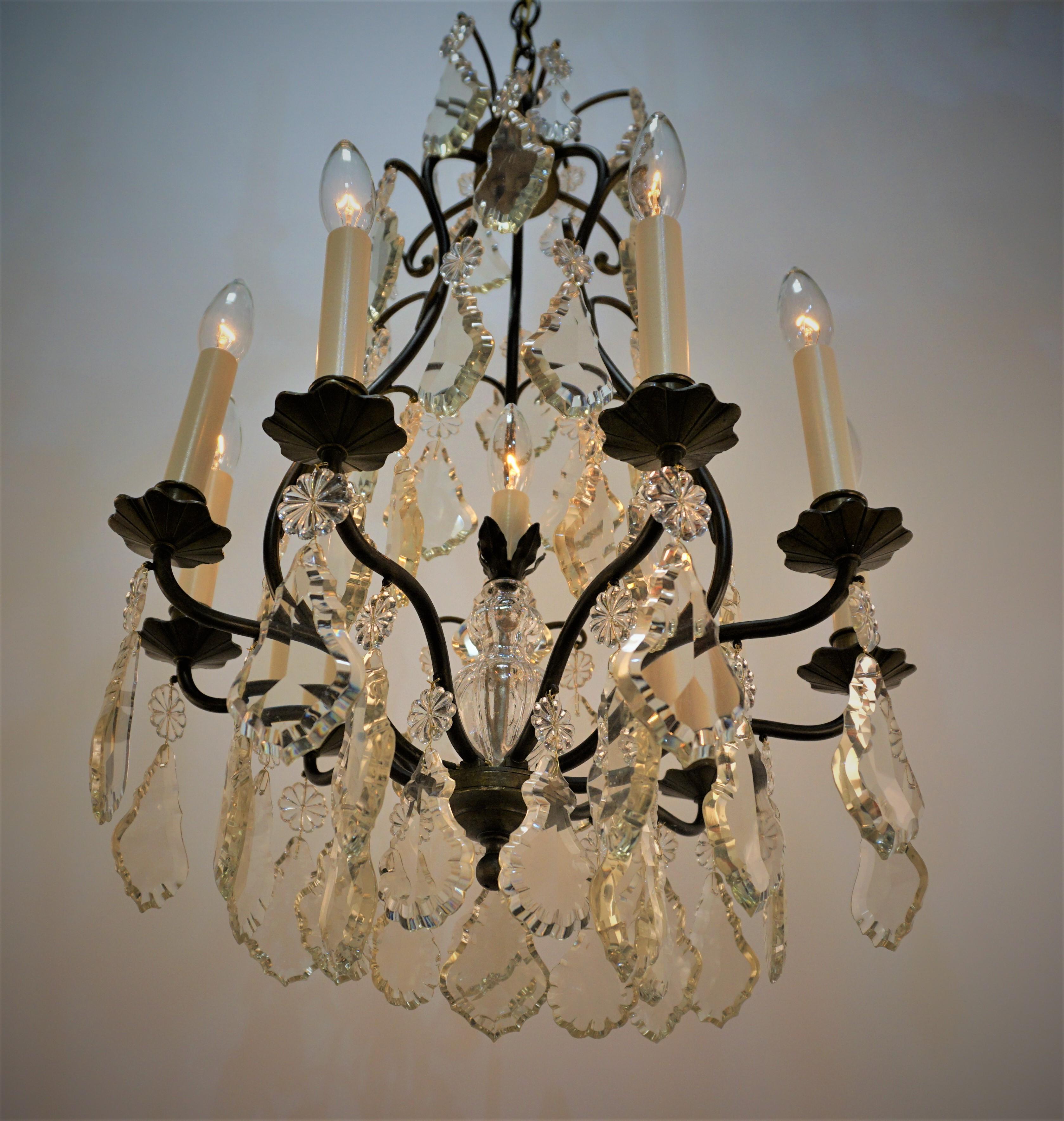 elegant six arm seven light clear and light Champaign color crystal chandelier with bronze frame.
 Minimum height full installed is 32