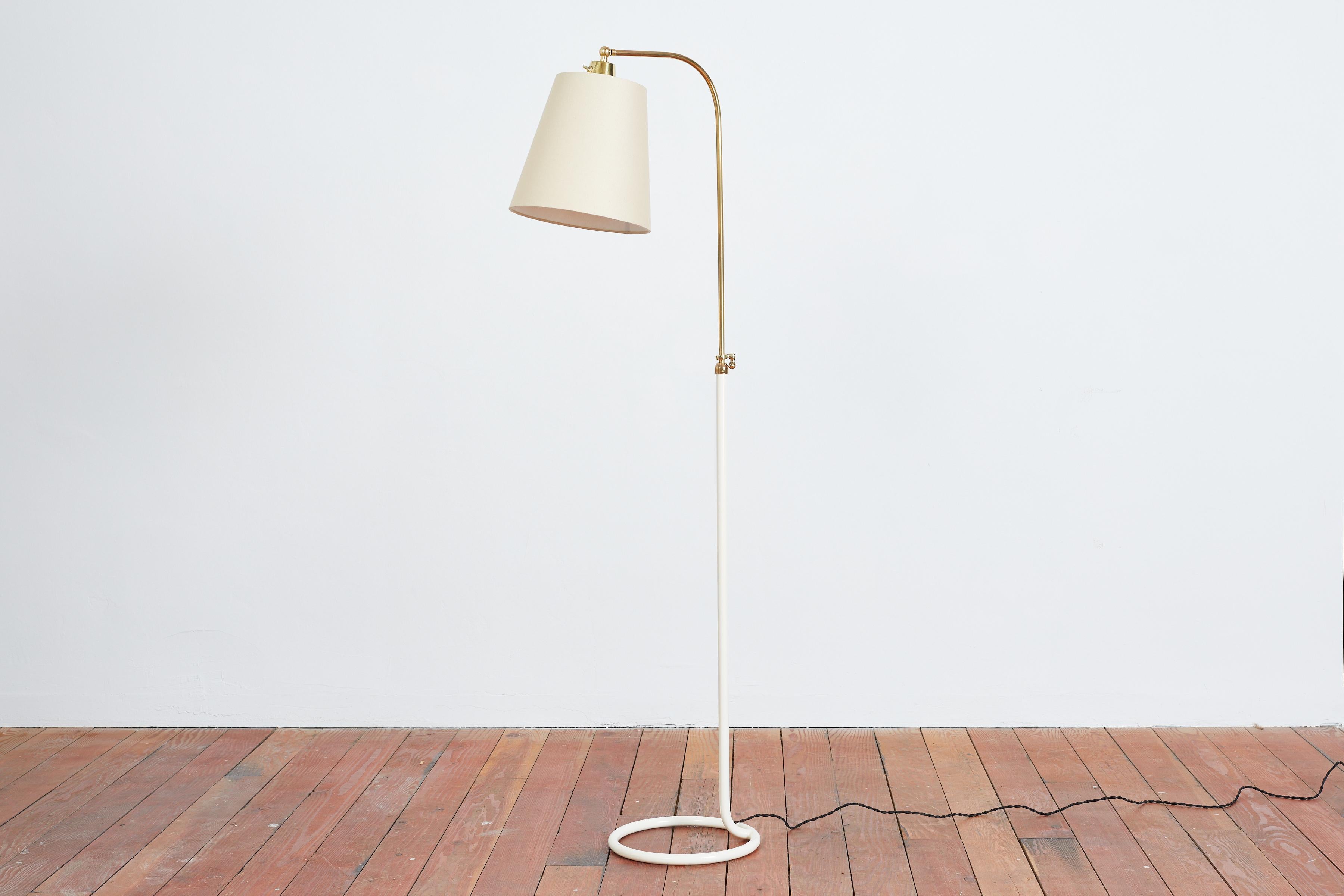 1940s French Floor Lamp with circular iron base 
Newly refinished with creamy white powder coated paint 
New linen shade 
Adjustable in height with brass hardware Height 54