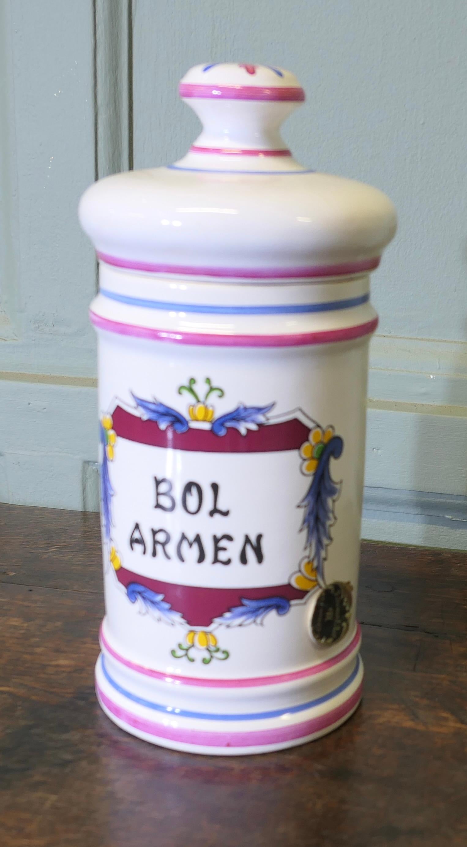 French Clamecy Earthenware Pharmacy Jar

This Faïence Pharmacy Jar is decorated mainly in dark red and pink, Bol Armen is the inscription on the front
A delightful piece, it is very clean inside and in good condition with its original lid, it is