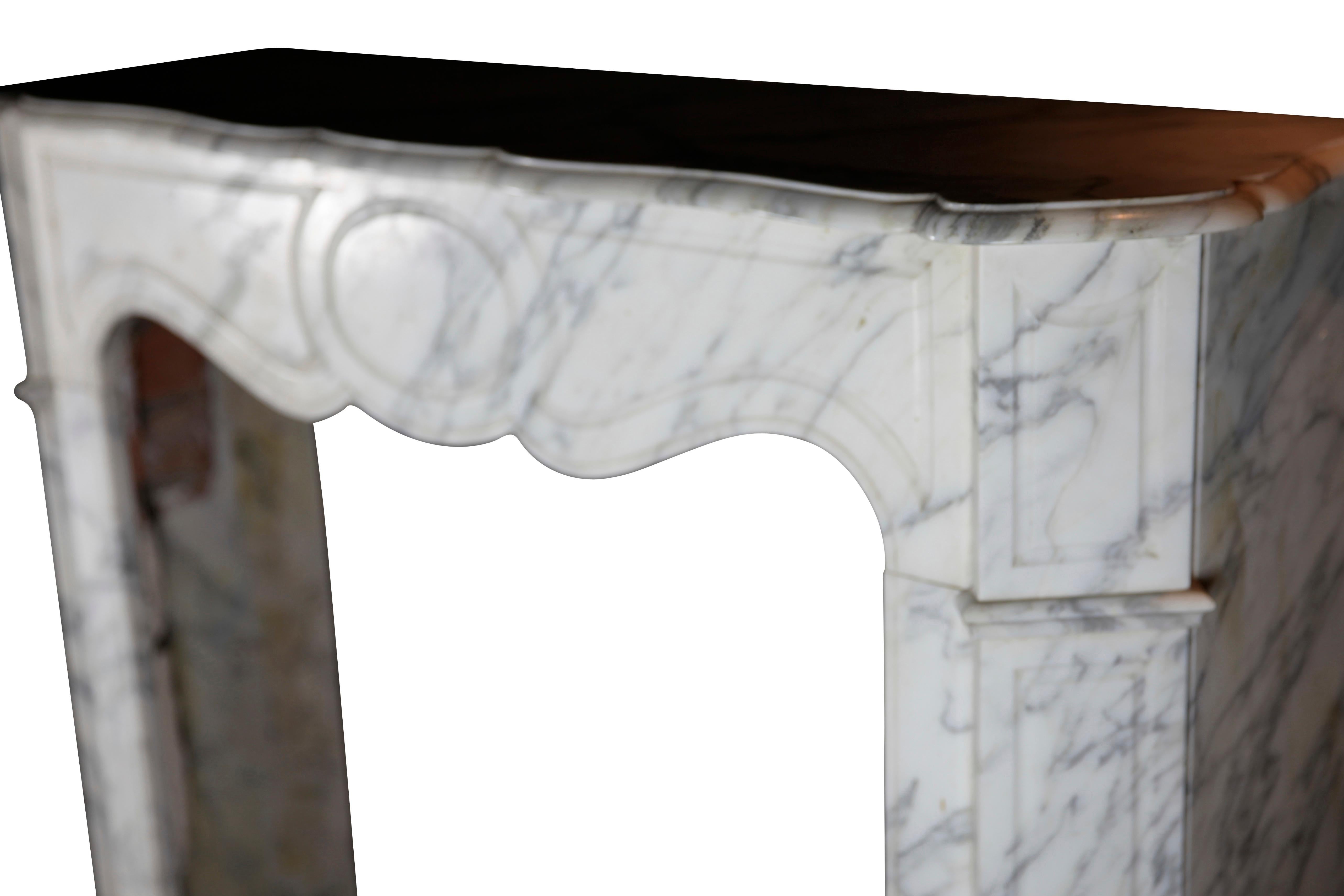 A original fine French Carrara marble vintage fireplace mantle which has no restoration. The Pompadour style was the perfect bedroom style in the 19th century.
Measures:
104 cm exterior width 40.94 inch
102 cm exterior height 40.16 inch
69 cm