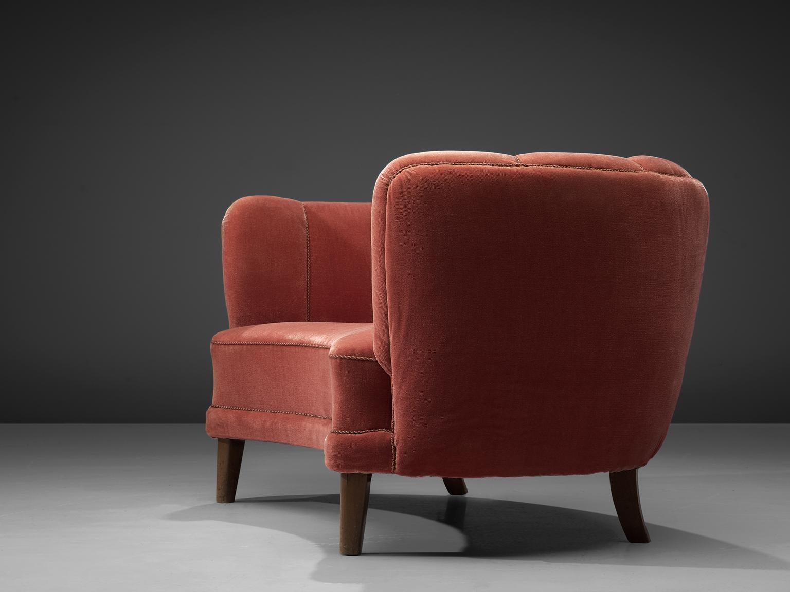 Sofa, red velvet and oak, France, 1950s

This voluptuous sofa is executed with wooden legs and shimmering red colored velvet fabric. The sofa has a high webbed, curved back and a thick body, both the back that flow into the armrests is bulky and