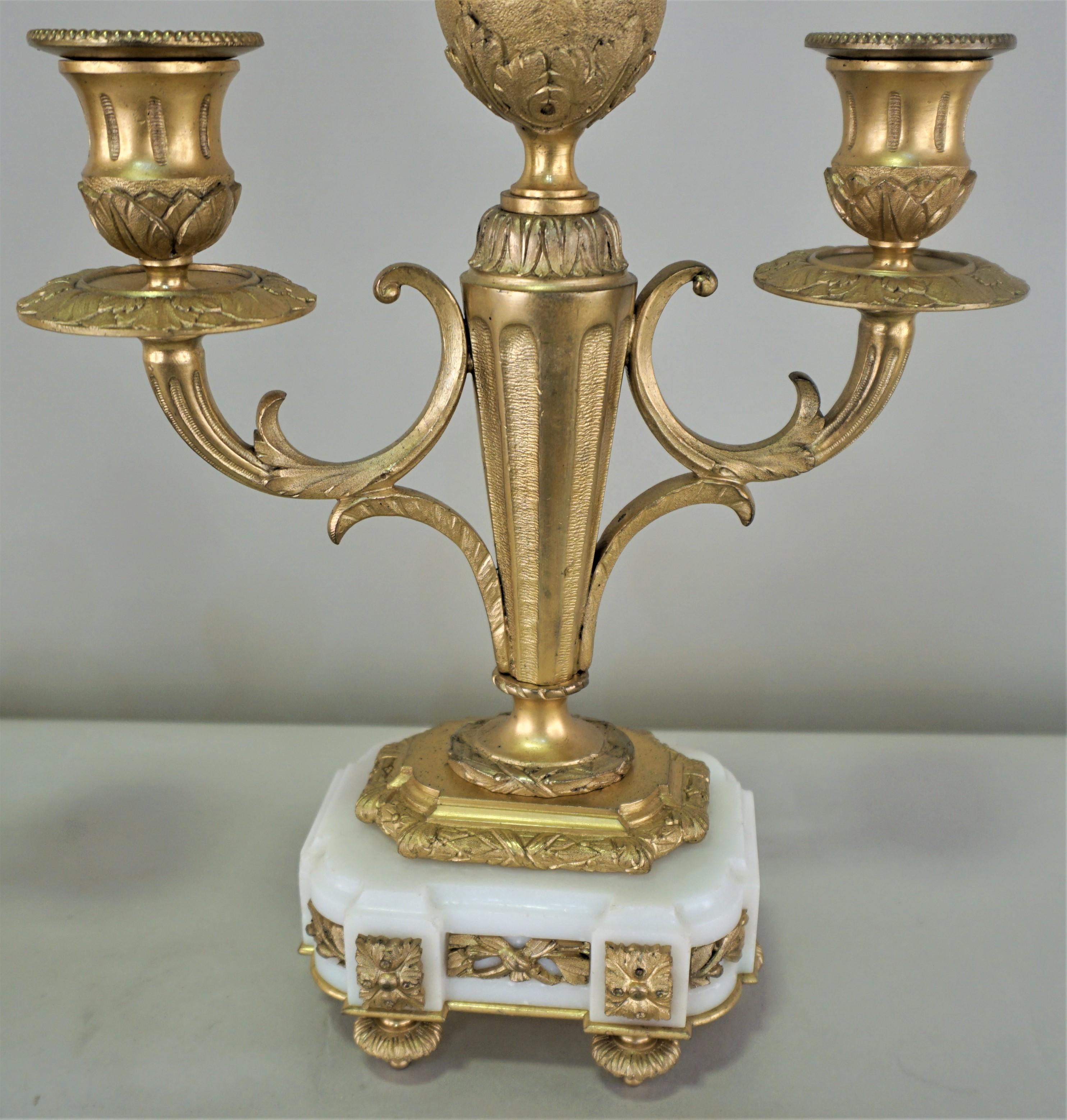 Elegant double arm bronze and marble candelabra.