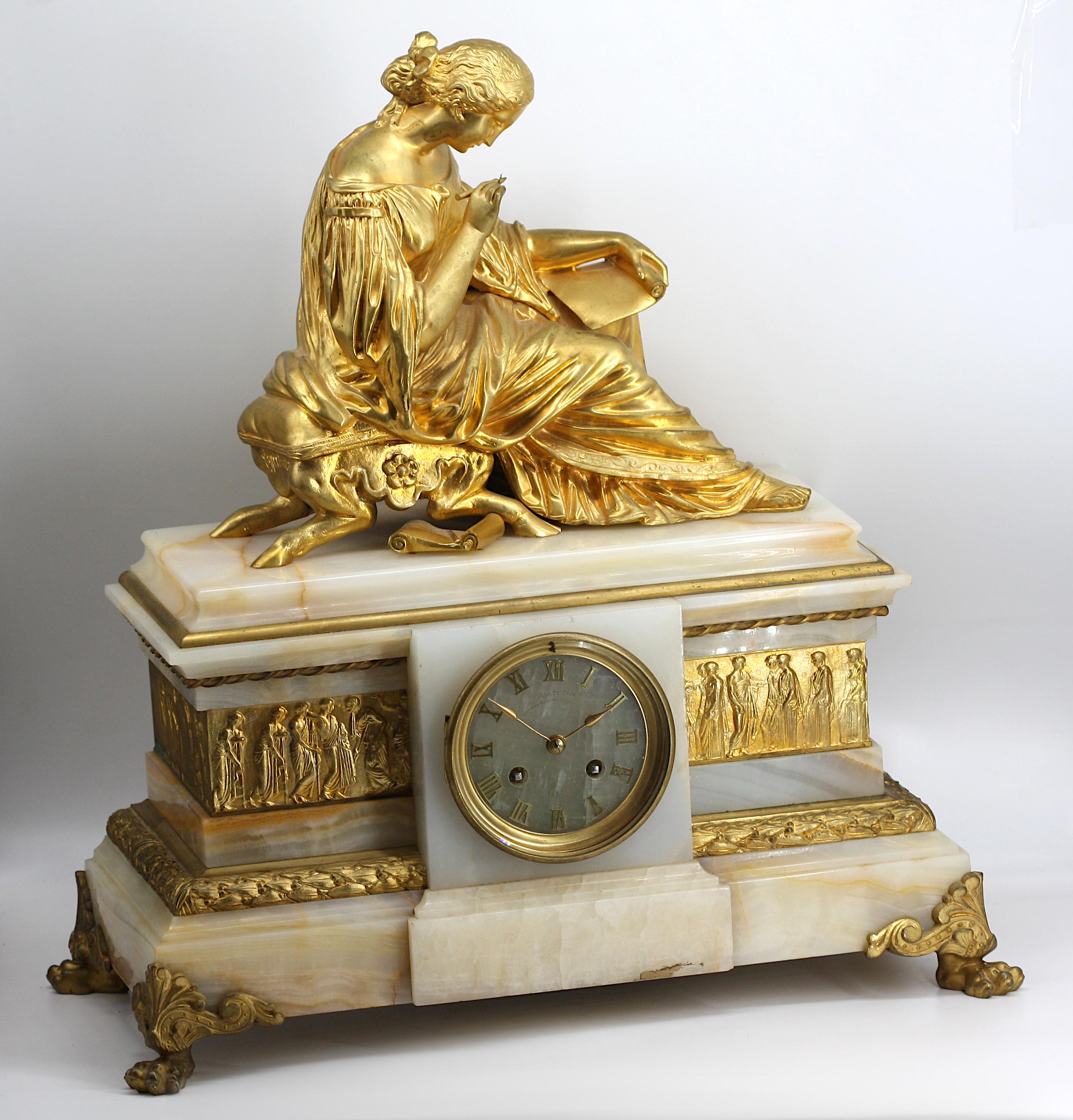 
French Classical Gilt Bronze and Onyx Mantle Clock
Late 19th Century. The dial signed Miroy (?) Fecit, Paris. The two-train movement with a circular onyx dial with brass Roman numerals, set in a shaped rectangular body with a gilt bronze band cast