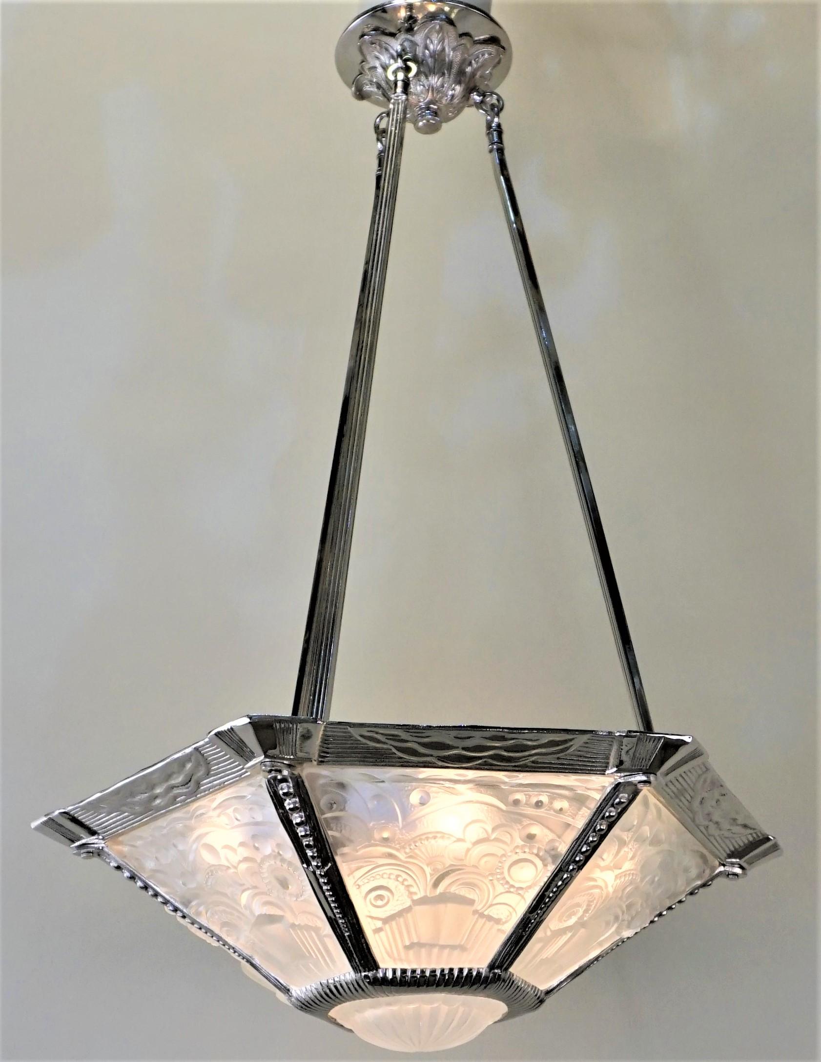 Elegant 1930s clear frost glass with nickel on bronze chandelier with total of nine lights by George Leleu.