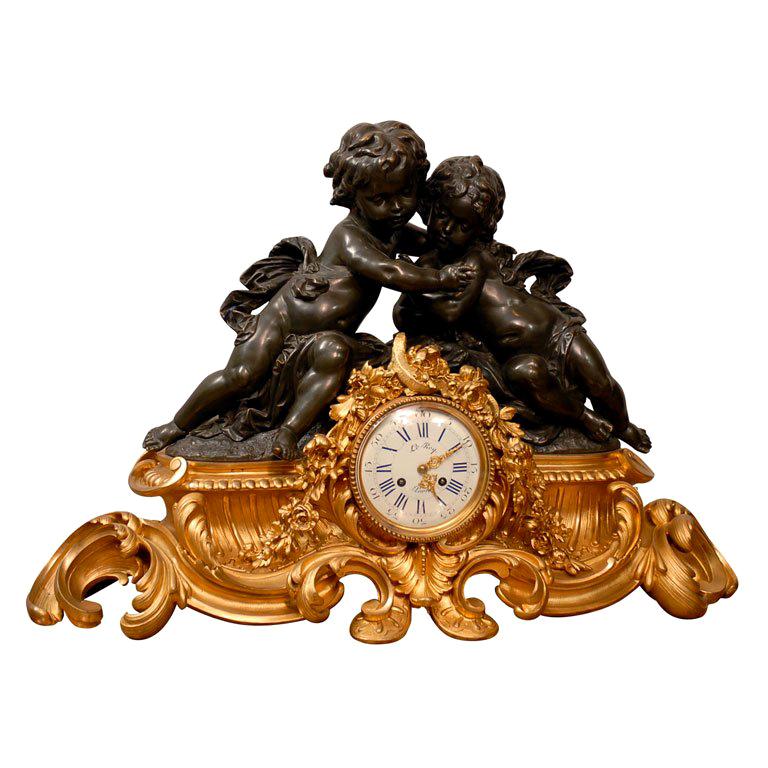 French Clock in Gilt and Patinated Bronze with Two Cherubs For Sale