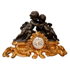 French Clock in Gilt and Patinated Bronze with Two Cherubs