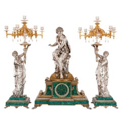 French Clock Set in Malachite, Gilt and Silvered Bronze