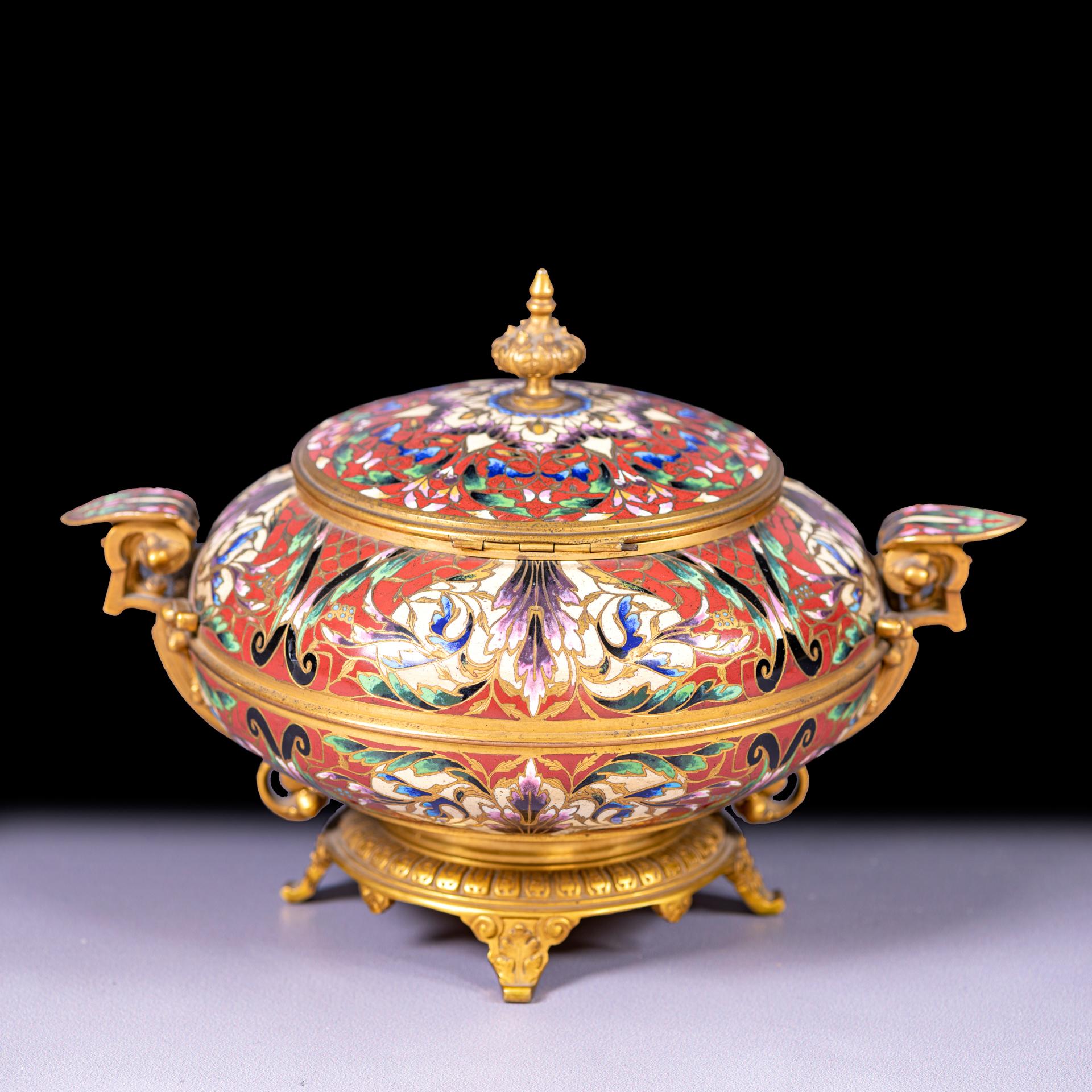 A late 19th century French Cloisonné enamel and ormolu mounted covered tureen, the richly decorated cloisonné enameling with floral and foliate motifs are executed in vibrant hues of red, green, purple, turquoise, and white, all outlined in fine