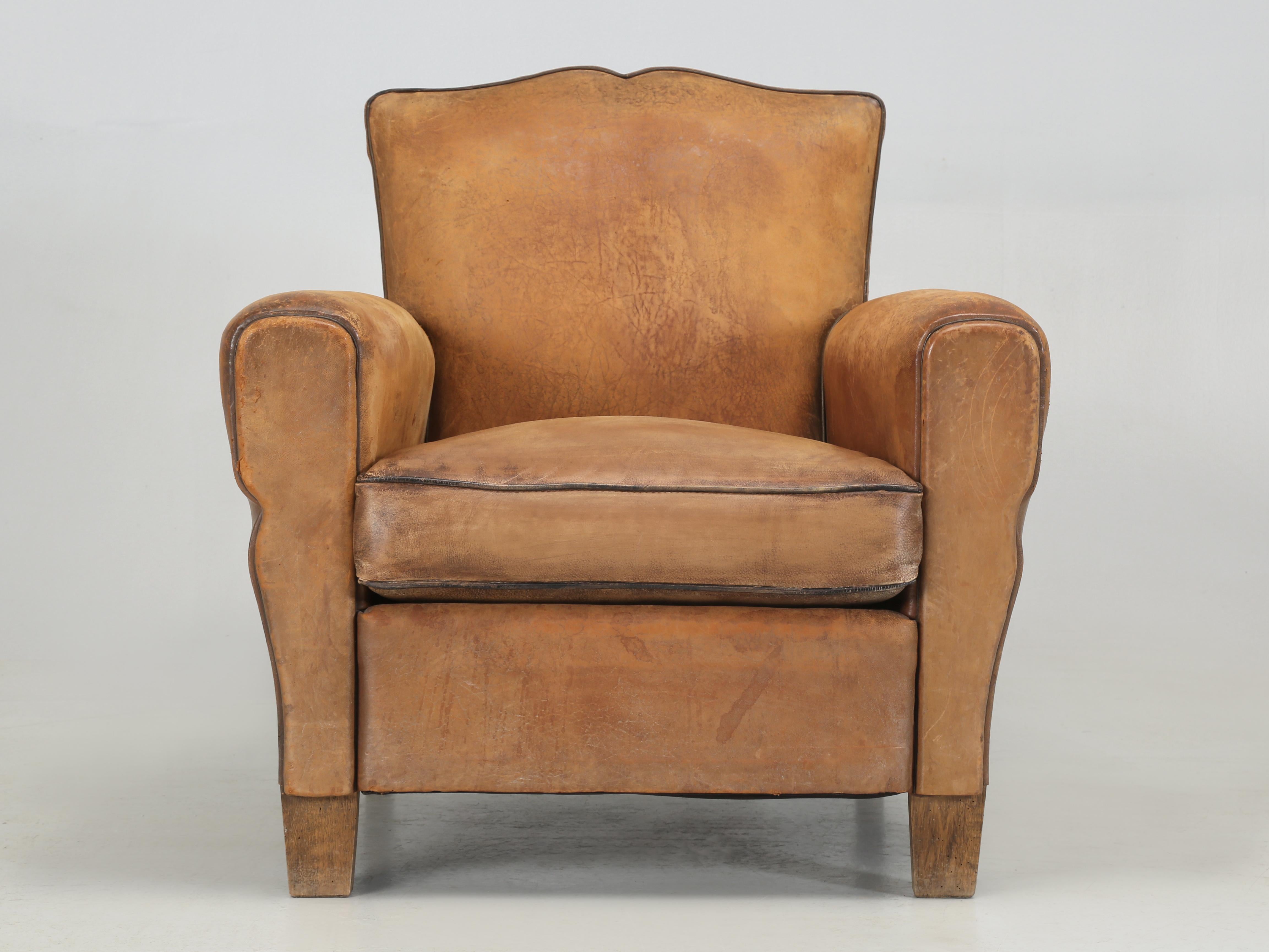 French Leather Club Chair that has been disassembled and completely rebuilt using old world techniques and materials, such as; real horsehair, shredded coco fibers and wadded wool. Over 40-man hours of labor were spent properly restoring this single