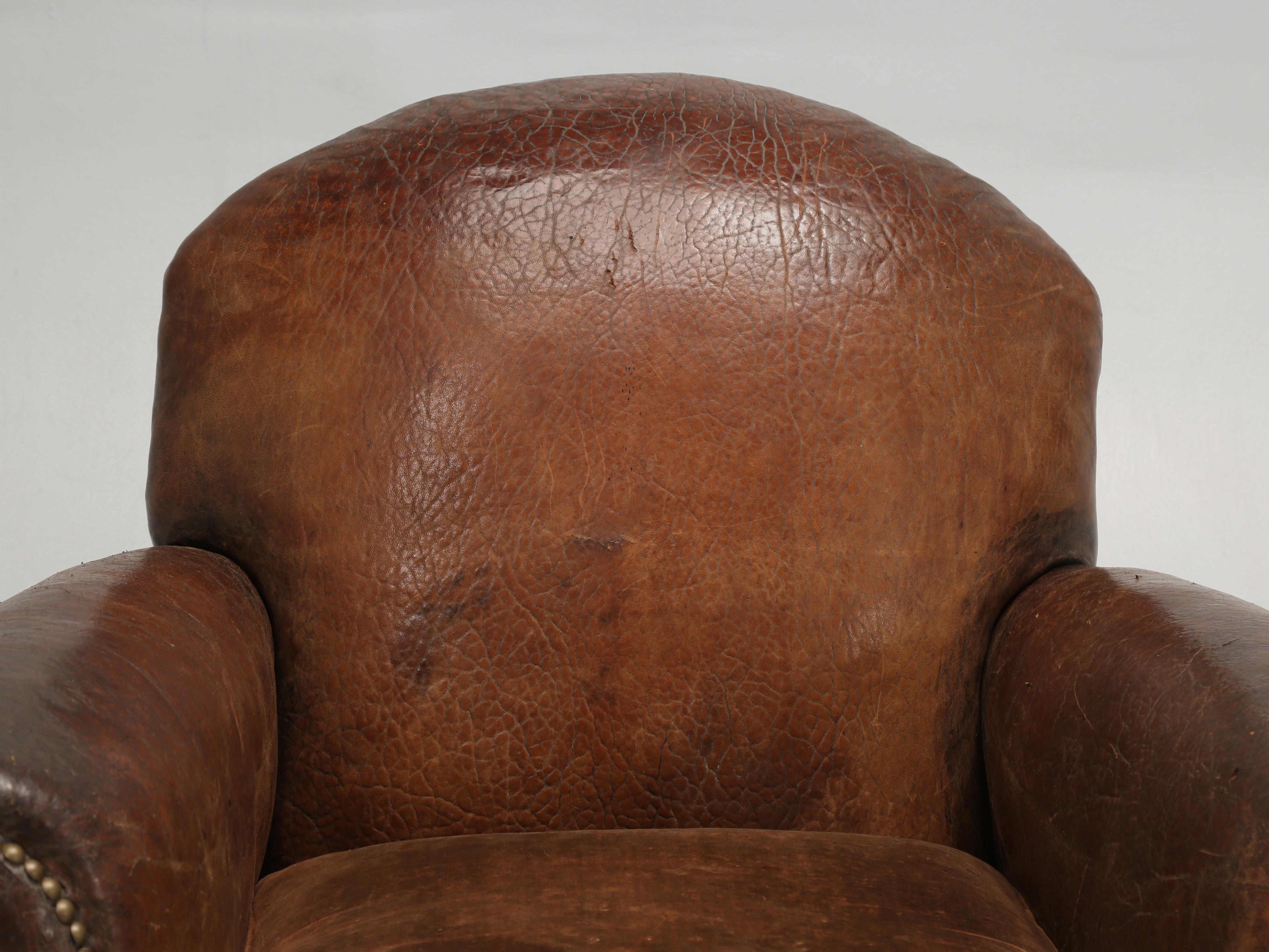 French leather pair of club chairs, but not just any old French leather club chairs, for this pair was painstakingly disassembled, restored internally, while only using the original padding material of horsehair and shredded coco fibers. After which