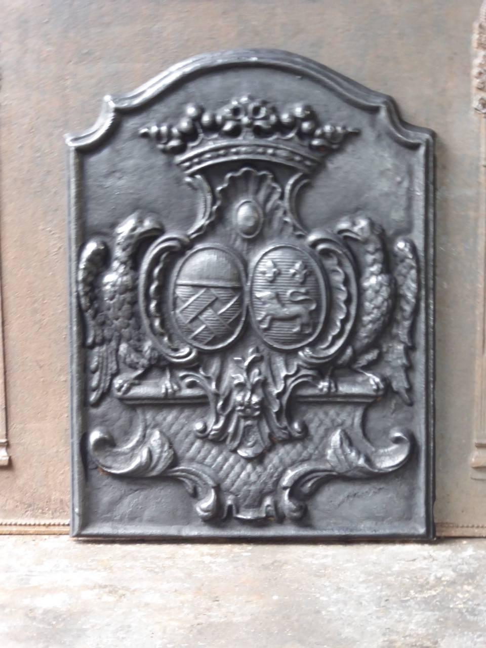 French Louis XIV style fireback with a coat of arms.







  