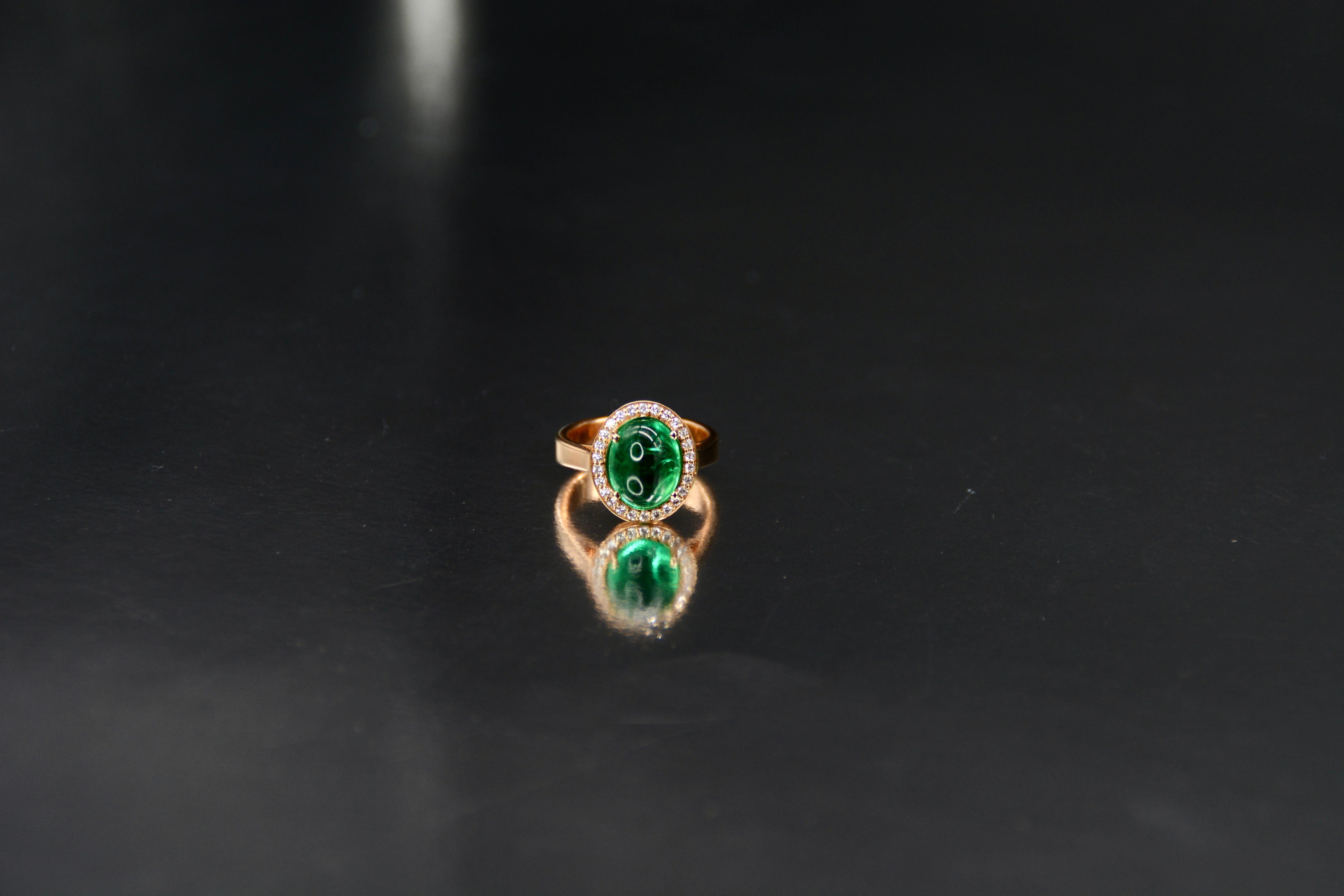 French Cocktail Ring Emerald Cabochon Set with Diamonds Pink Gold 

Discover our beautiful French cocktail ring that is sure to captivate all eyes. This exceptional piece features a 12 x 7 mm emerald cabochon, worth 4.02 carats.

The emerald