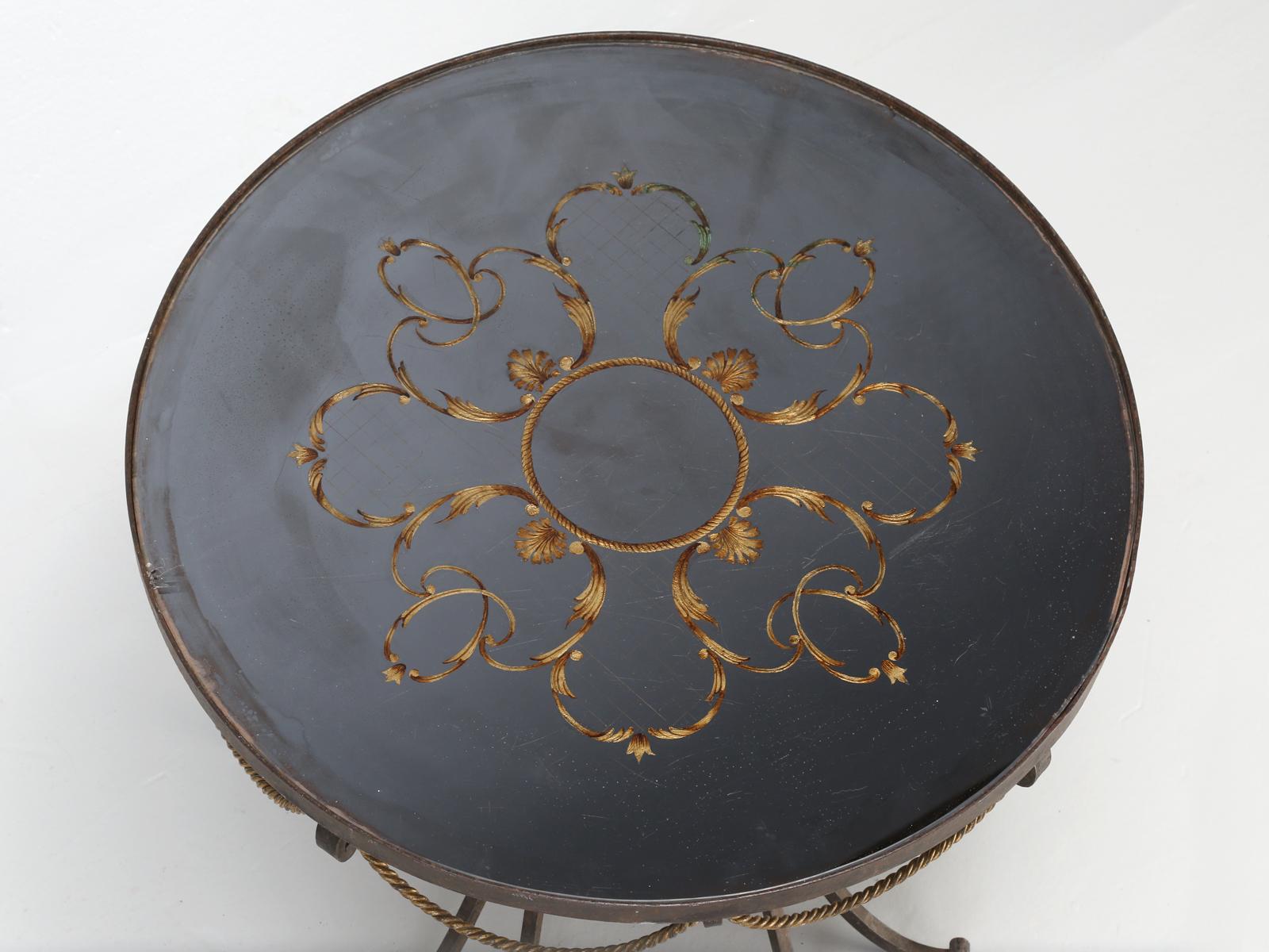 French art Deco coffee table, attributed to Raymond Subes (notable for his extraordinary ironwork) and Max Ingrand. Hand-fabricated wrought-iron table base, with gilded ornamentation. The glass top of our Raymond Subes coffee table, is commonly