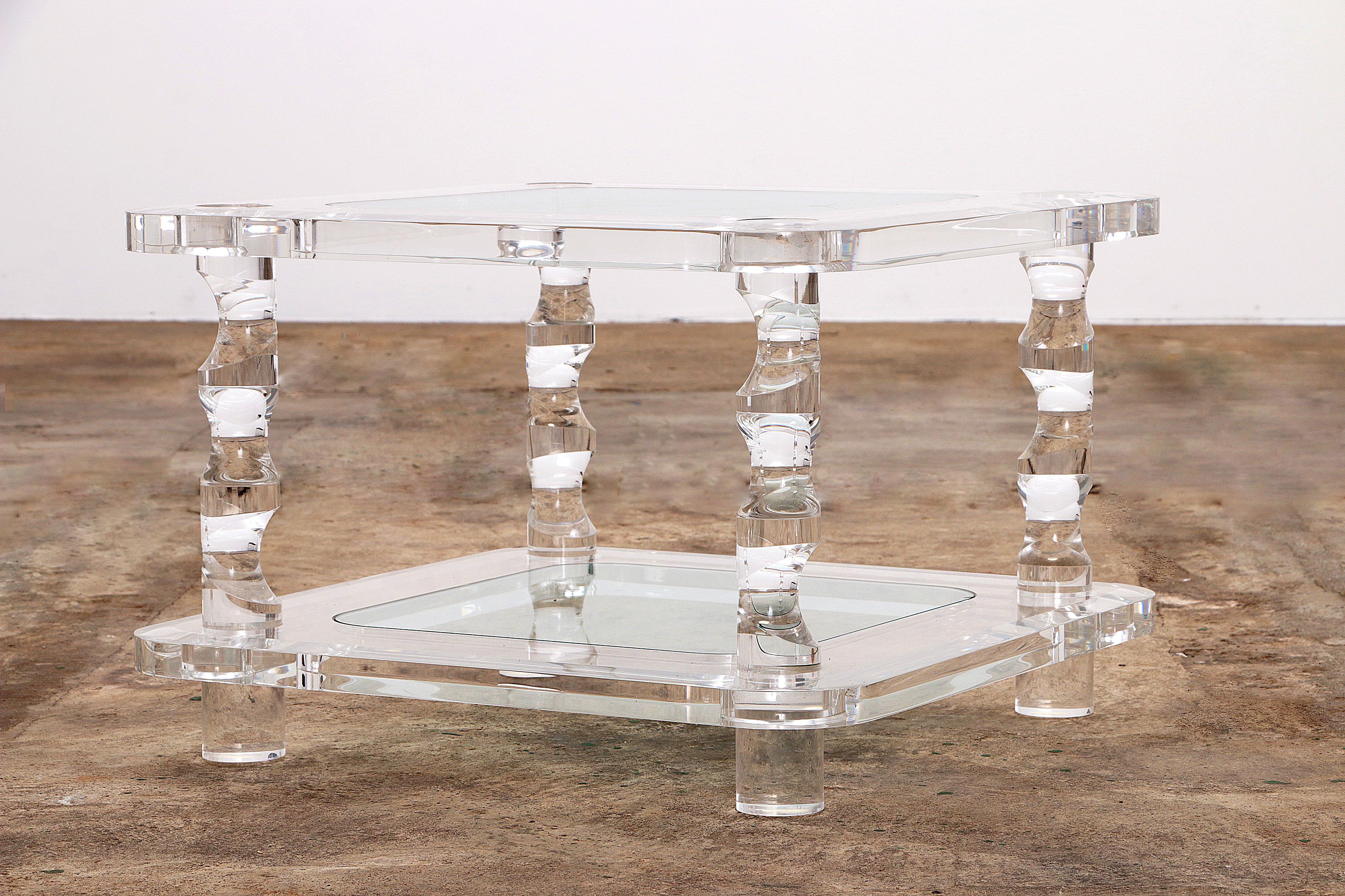 A beautiful coffee table in Lucite structure and glass from the French design house Maison Romeo. The table was produced around the 1970s and the design has a modern and stylish look.

The table consists of two beautiful clear glass plates. All