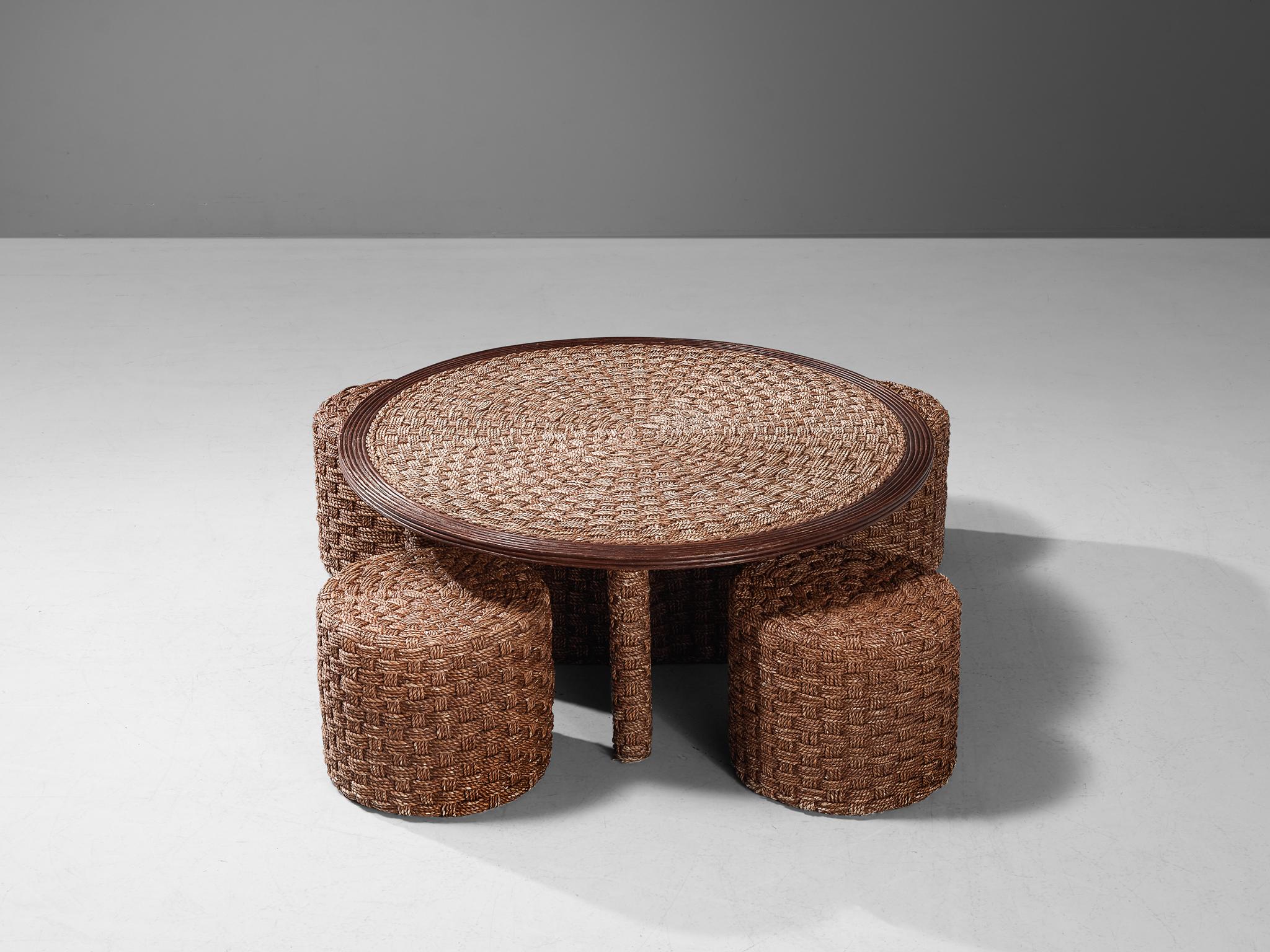 Coffee table with four stools, rope, cane, wood, France, 1960s. 

This coffee table set with four stools clearly shows traits of designs by Adrian and Frida Audoux-Minet. The similarities can be found in application of the rustic woven rope. Note