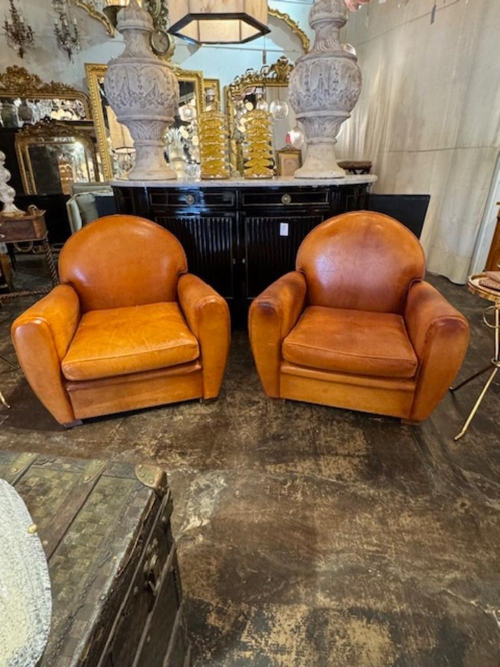 Great pair of vintage French cognac leather club chairs. Circa 1940. These chairs are stylish and comfortable. 36w x 38d x 33h