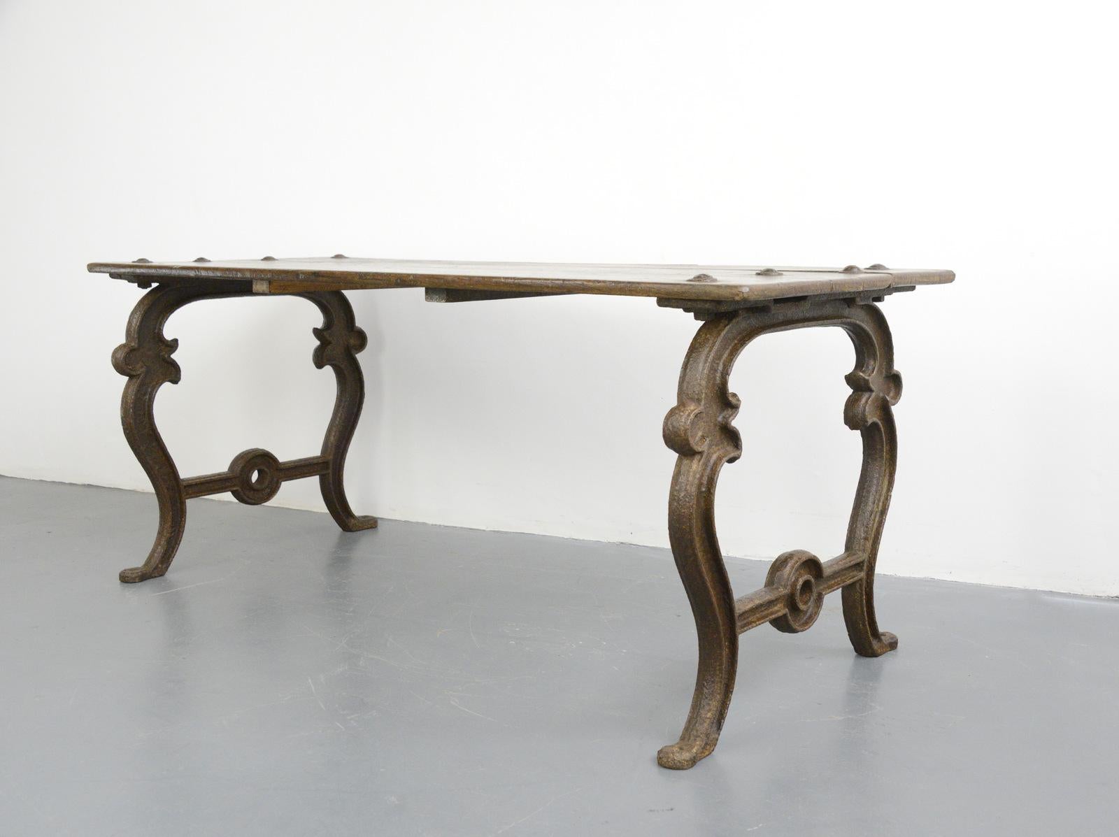 French Colonial North African work table, circa 1800

- Ornate cast iron base
- Solid 3 plank oak top
- Blacksmith made bolts
- Originally came from a workshop in Algeria and its last home was in Egypt before coming back over to France
-