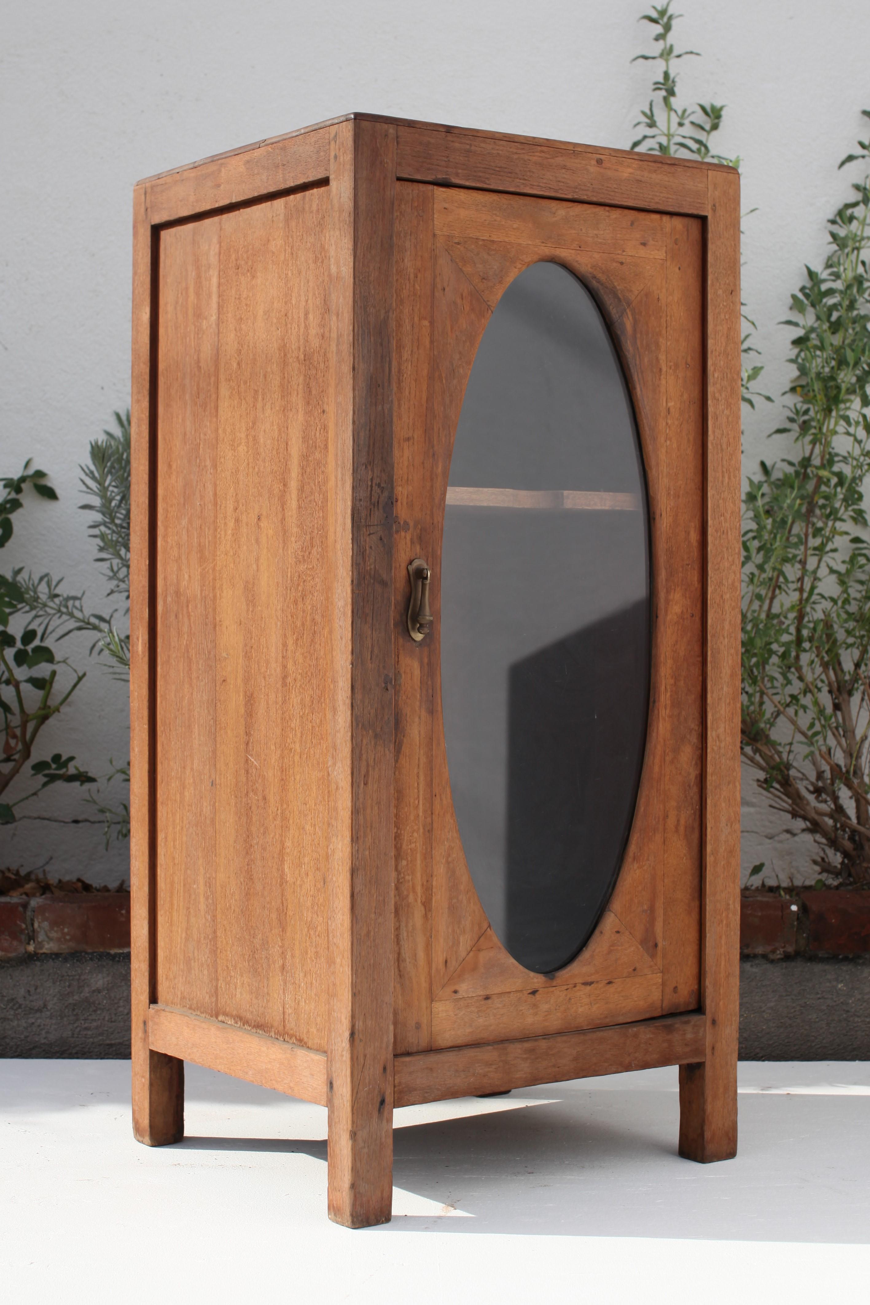 Hand-Crafted French Colonial Oval Window Weathered Teak Cabinet, 1930's For Sale