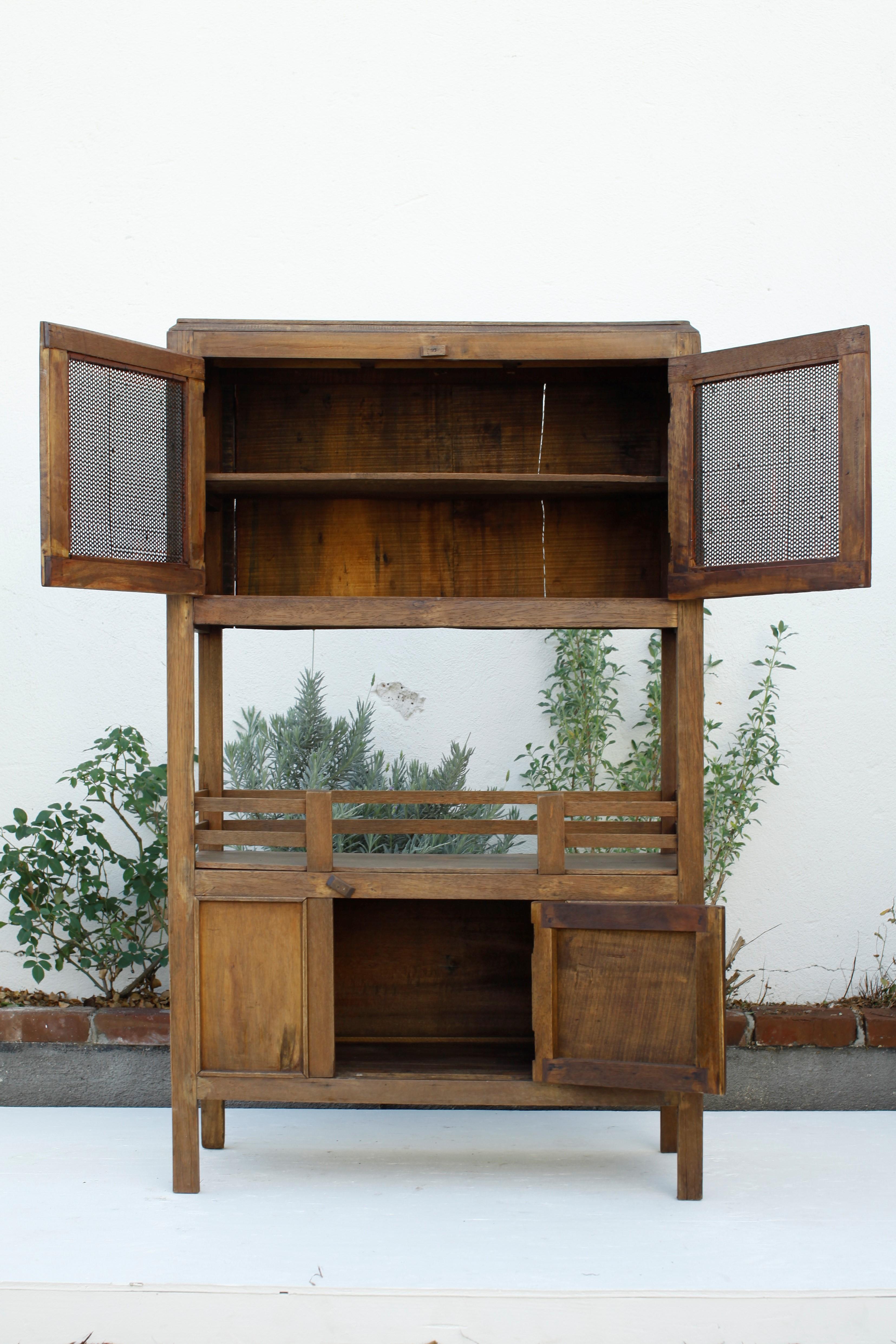 French Provincial French Colonial Weathered Teak Cabinet with Metal Screen Doors 1930's For Sale