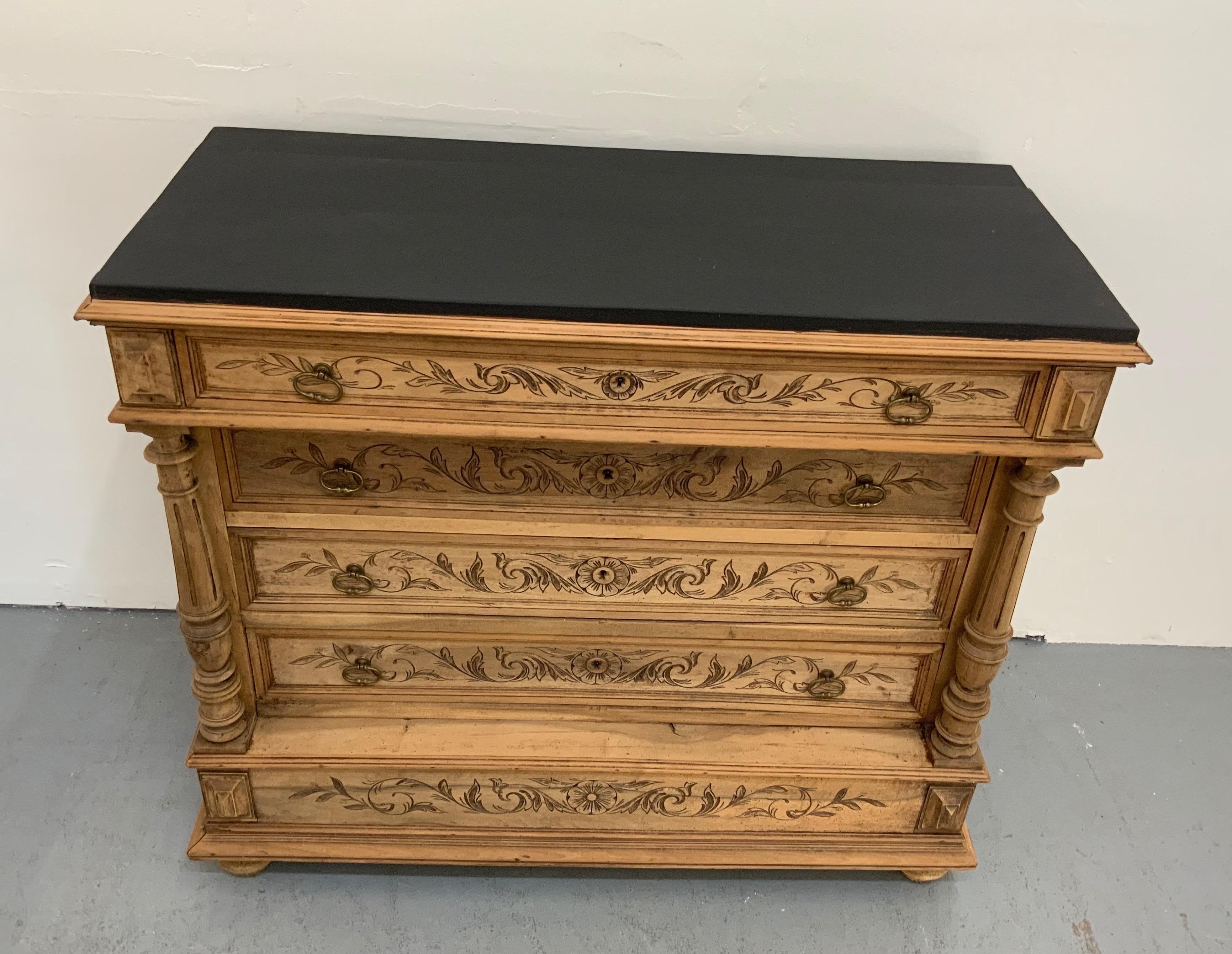 French antique commode Henry II style, made in walnut bleached and top has be redone and painted in black, from early 29th century with 4 drawers with special carvings.